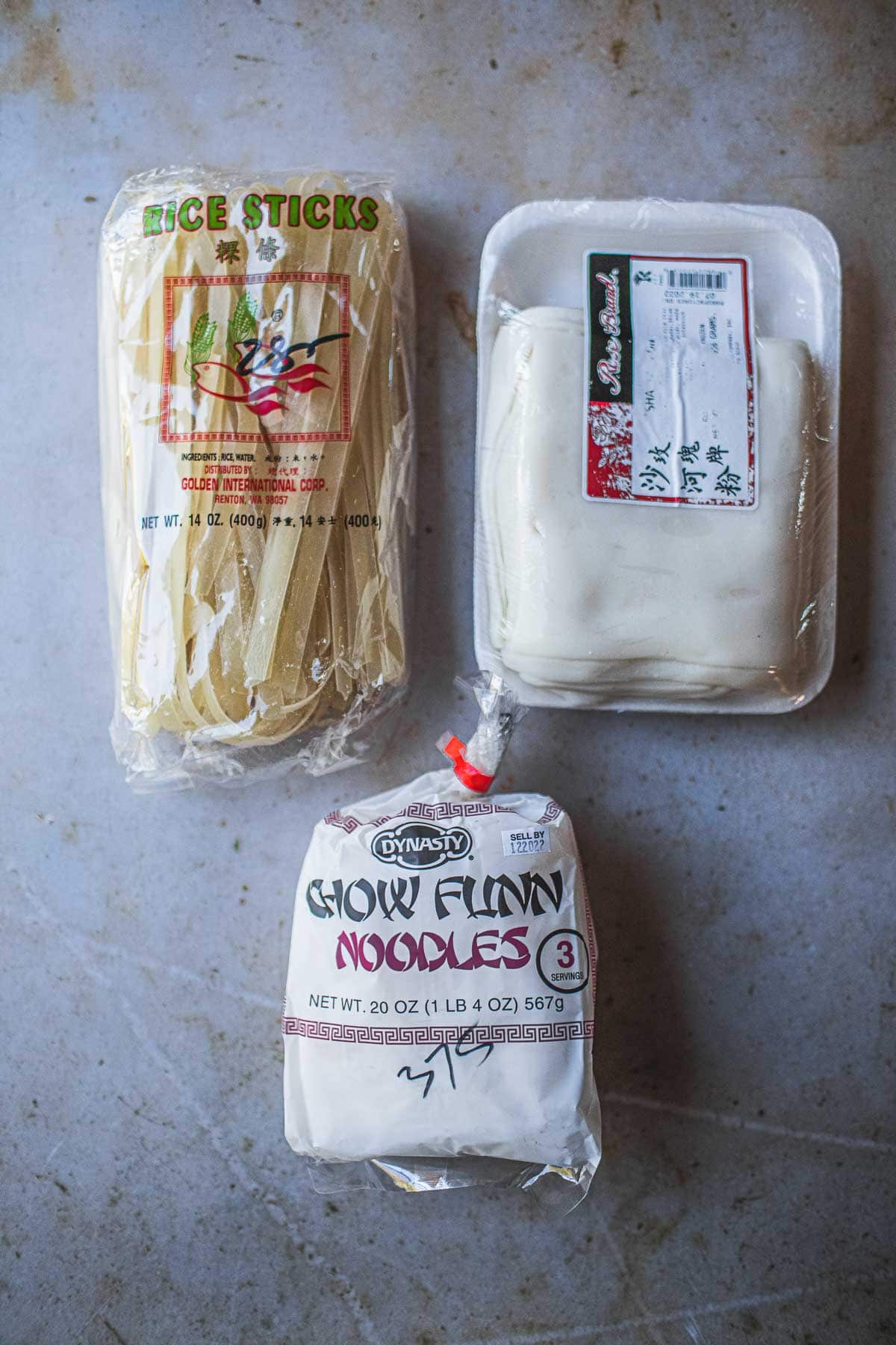 3 types of rice noodles on a counter. 