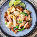 Pad See Ew is a delicious Thai stir-fried noodle dish using wide rice noodles, Chinese broccoli, eggs, your choice of protein ( chicken, tofu, shrimp) and a flavorful sweet soy stir-fry sauce.