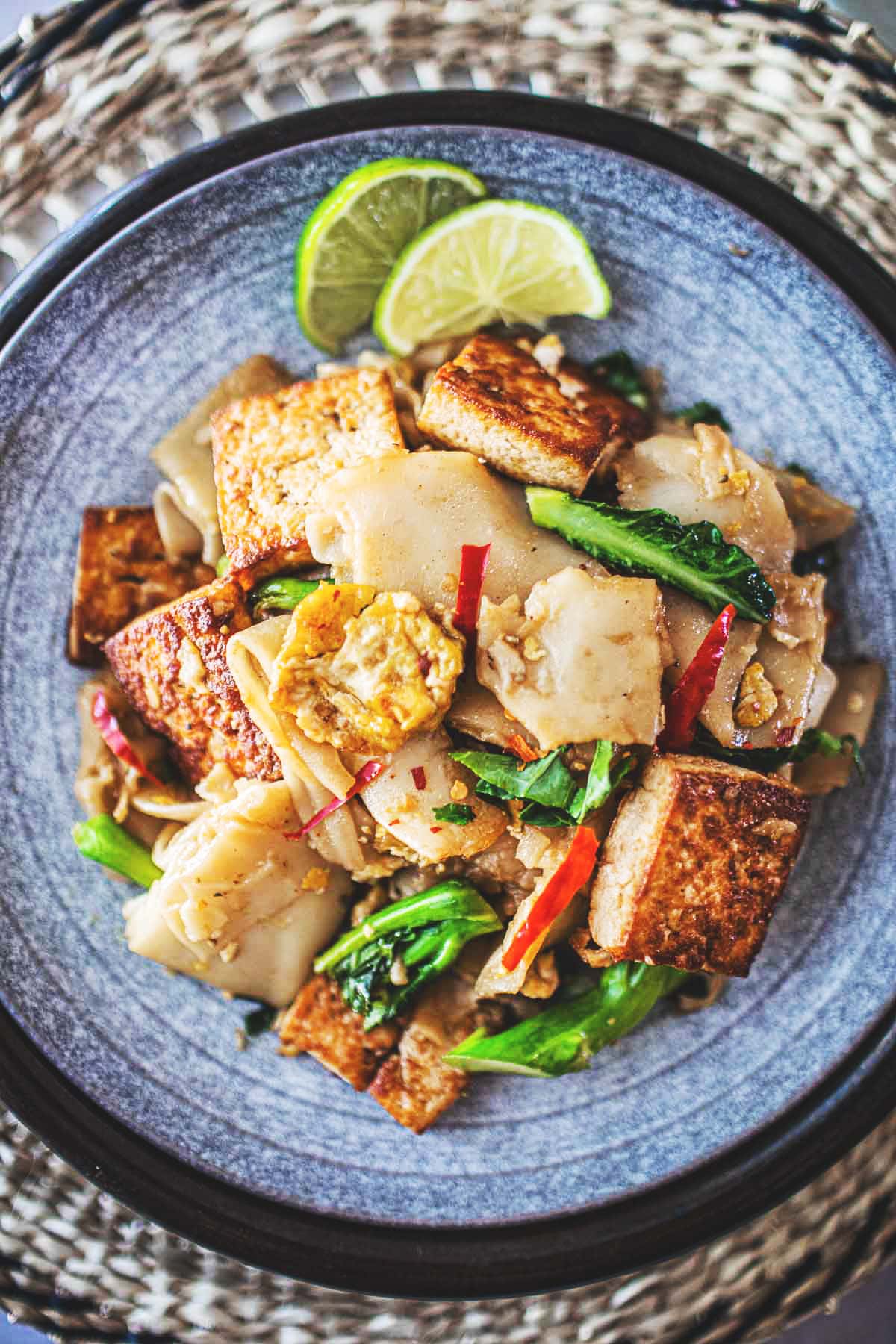 Pad See Ew is a delicious Thai stir-fried noodle dish using wide rice noodles, Chinese broccoli, eggs, your choice of protein ( chicken, tofu, shrimp) and a flavorful sweet soy stir-fry sauce. 