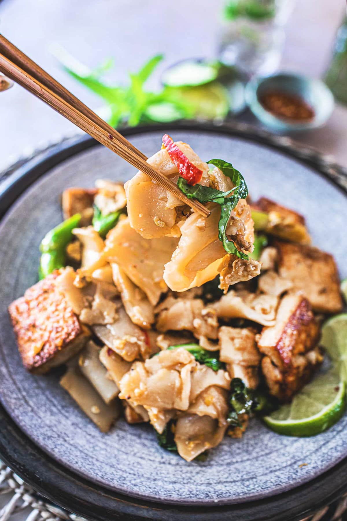 Pad See Ew is a delicious Thai stir-fried noodle dish using wide rice noodles, Chinese broccoli, eggs, your choice of protein ( chicken, tofu, shrimp) and a flavorful sweet soy stir-fry sauce. 
