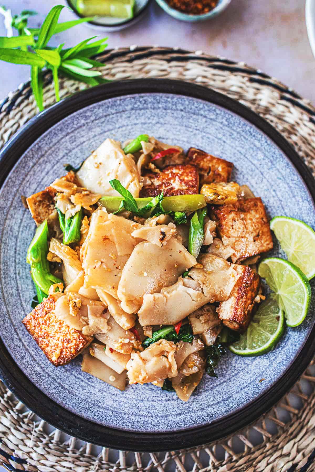 Pad See Ew is a delicious Thai stir-fried noodle dish using wide rice noodles, Chinese broccoli, eggs, your choice of protein ( chicken, tofu, shrimp) and a flavorful sweet soy stir-fry sauce. 