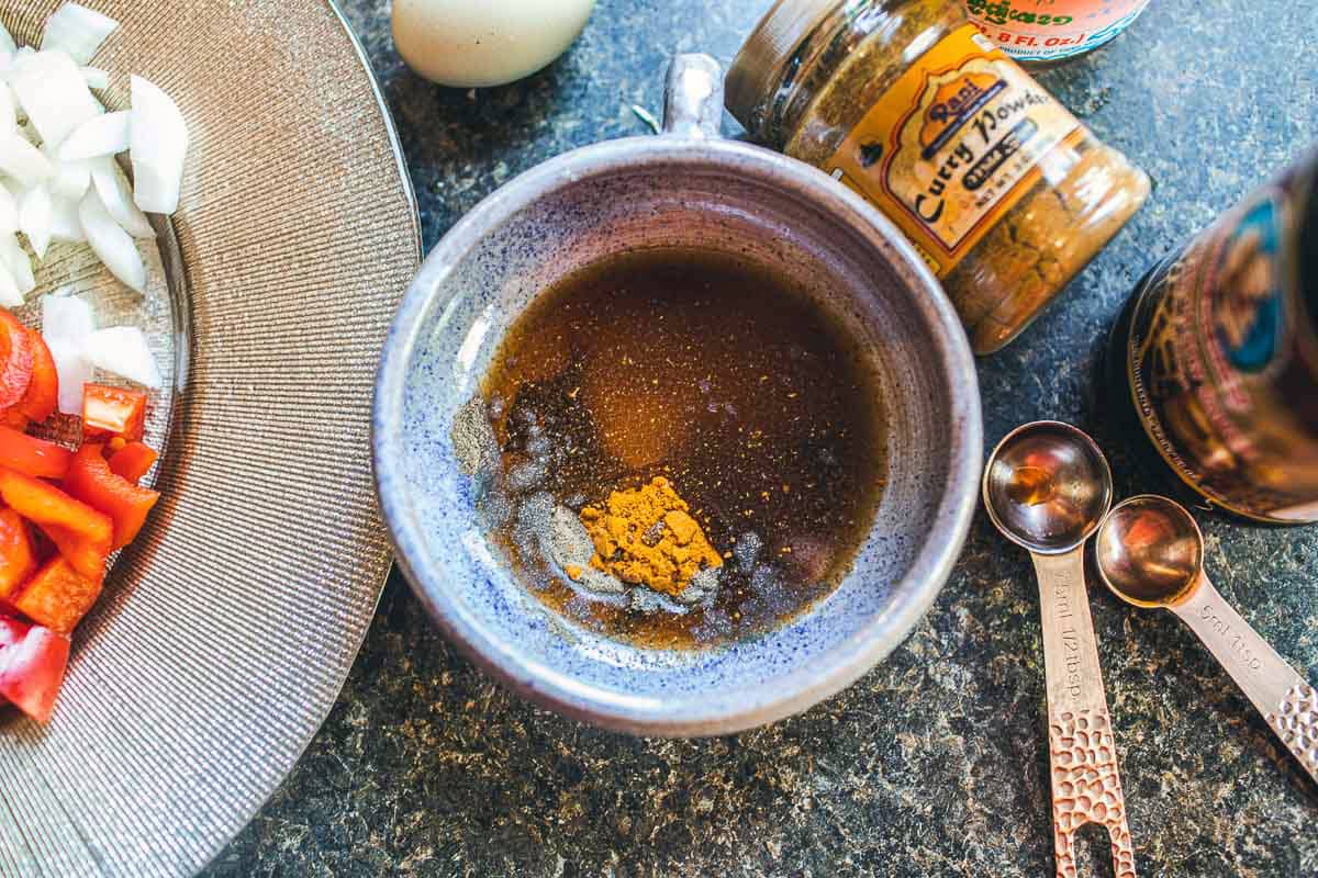 sauce with curry powder in a small round bowl on counter