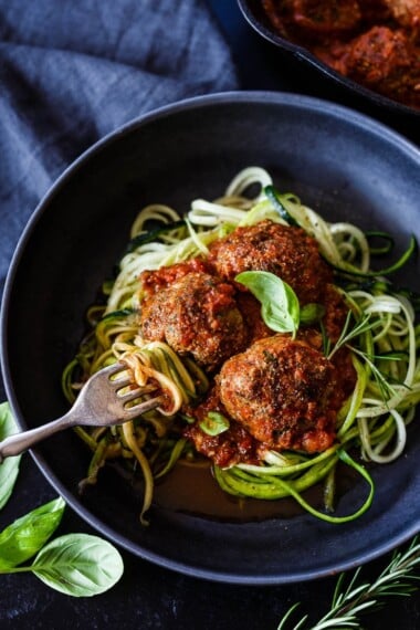 These flavorful Italian Meatballs are chock full of fresh herbs and savory goodness.  Fast and easy they can be made in 30 minutes. Serve them with zucchini noodles, roasted spaghetti squash, pasta, creamy polenta or in a roll. Low-carb, keto and gluten-free.