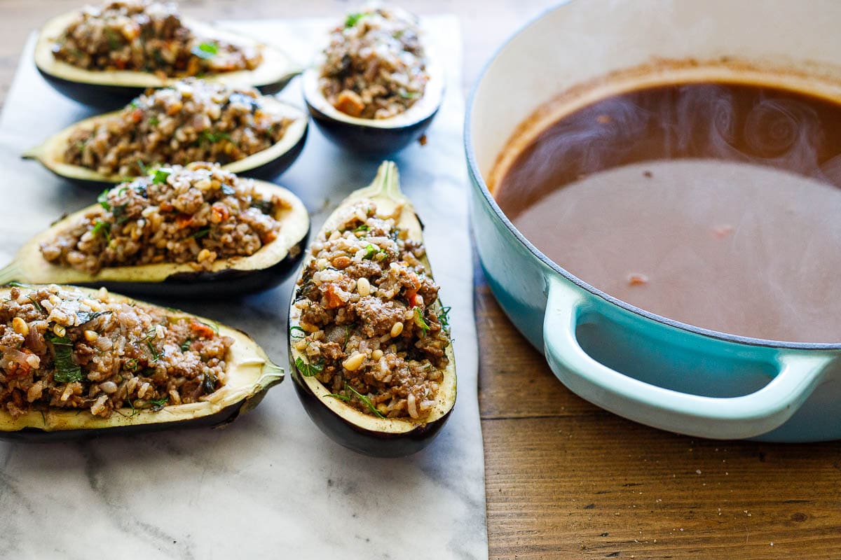 Stuffing the eggplant shells.