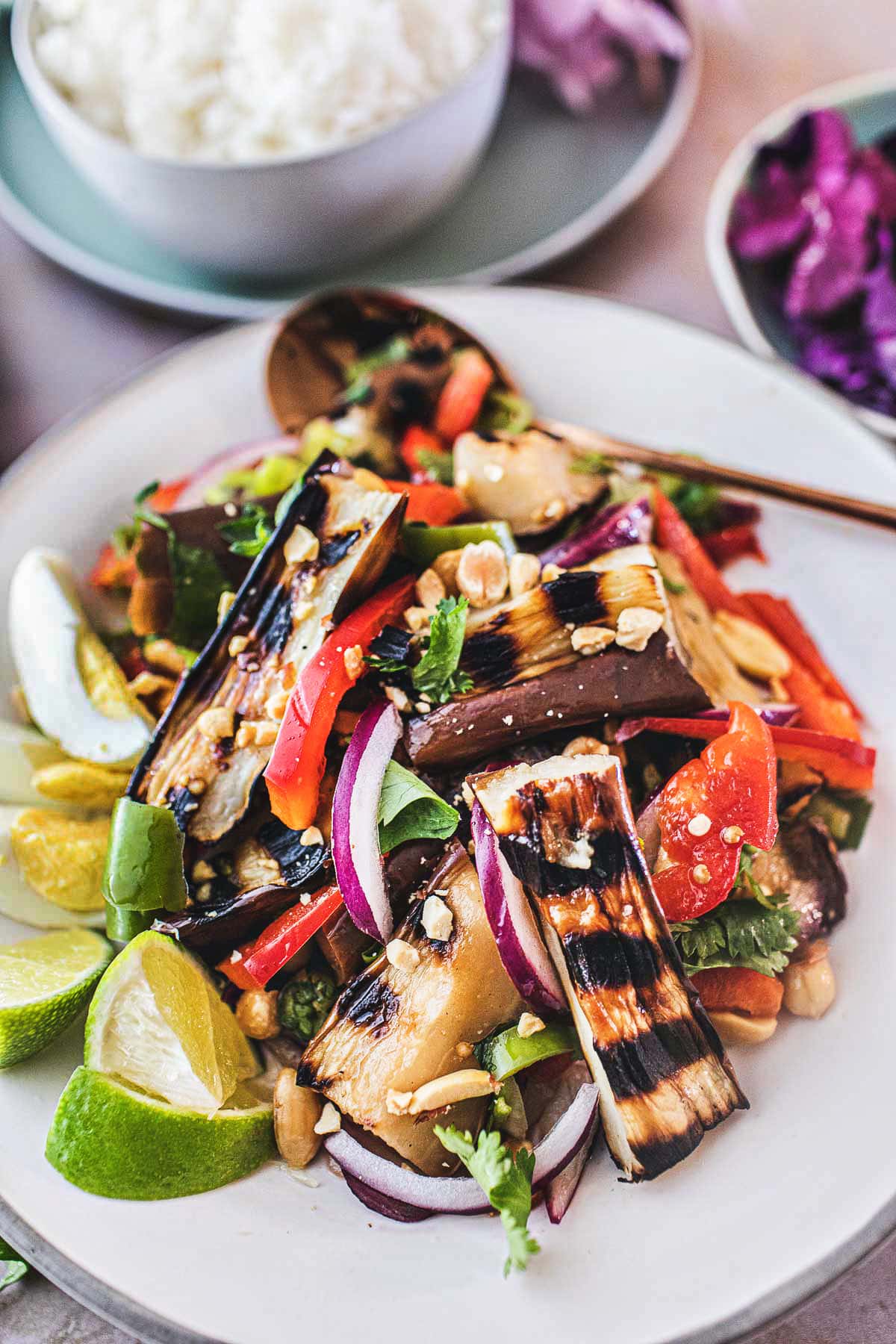 This flavorful Thai Grilled Eggplant Salad is simple, light, and refreshing with a tangy, umami dressing made from fresh lime juice and fish sauce. Healthy and tasty, this Thai Salad comes together in 35 minutes! (Vegan-adaptable) Serve it with jasmine rice and make it a meal.