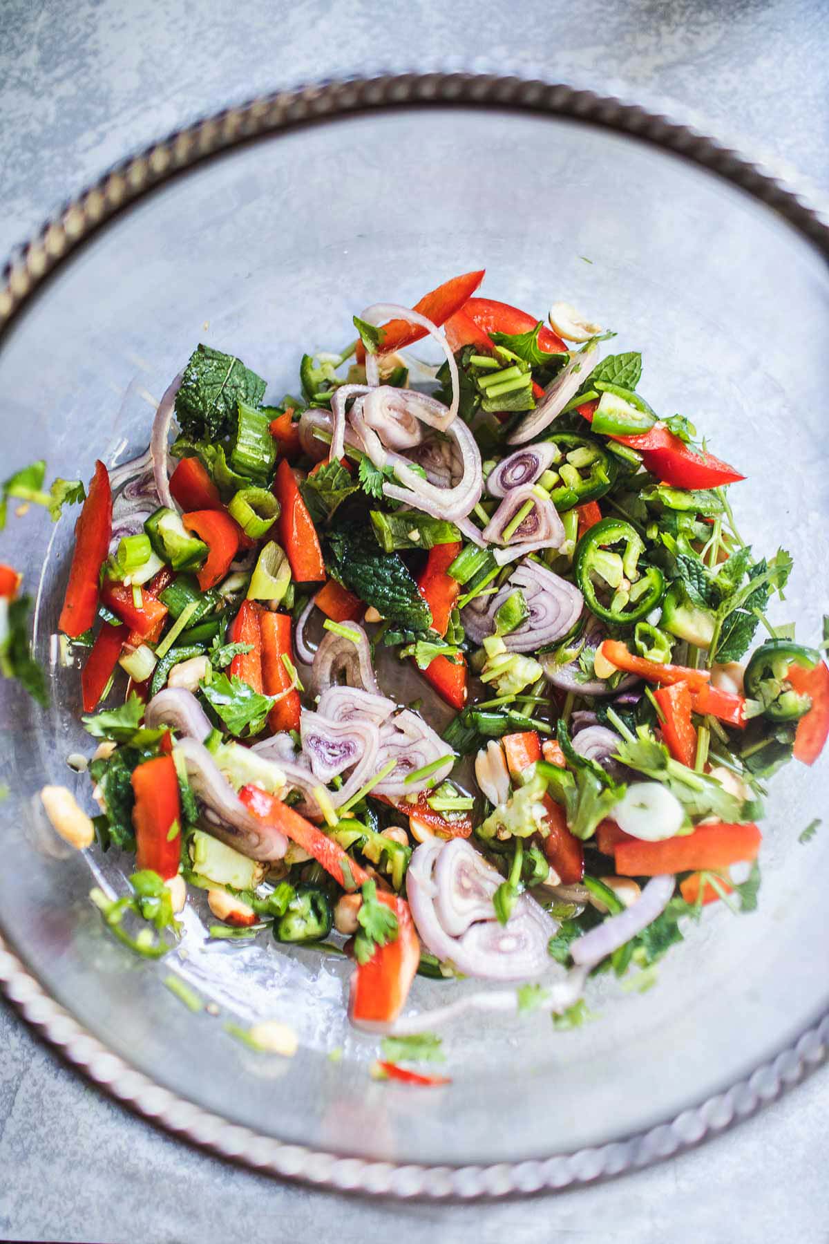 This flavorful Thai Grilled Eggplant Salad is simple, light, and refreshing with a tangy, umami dressing made from fresh lime juice and fish sauce.