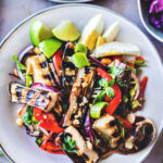 This flavorful Thai Grilled Eggplant Salad is simple, light, and refreshing with a tangy, umami dressing made from fresh lime juice and fish sauce. Healthy and tasty, this Thai Salad comes together in 35 minutes! (Vegan-adaptable) Serve it with jasmine rice and make it a meal.