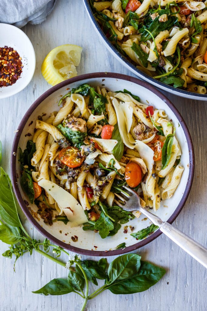 pasta with tuna, olive tapenade, fresh tomatoes, cheese, and herbs. 