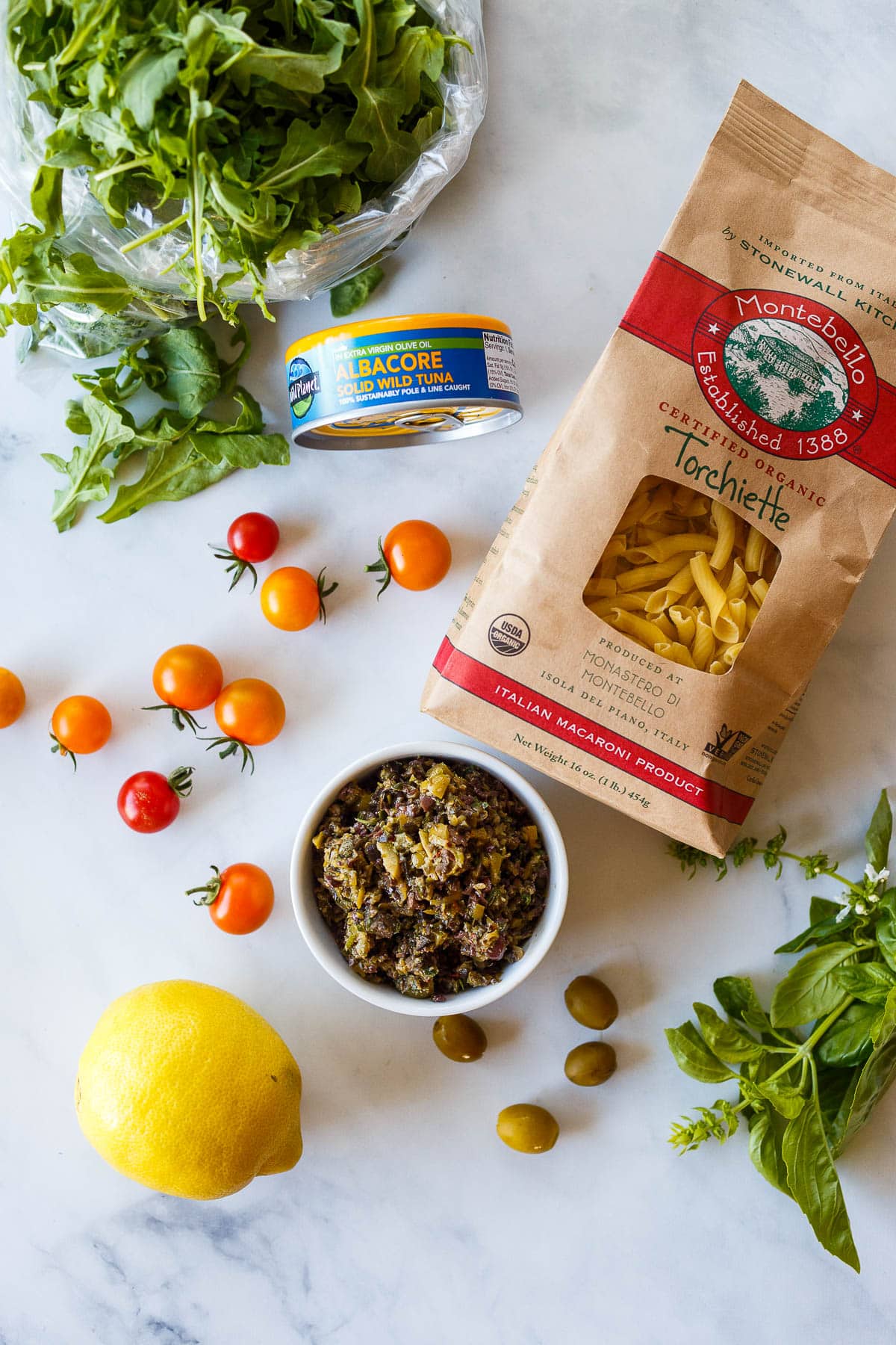ingredients in tuna pasta with olive tapenade and fresh tomatoes