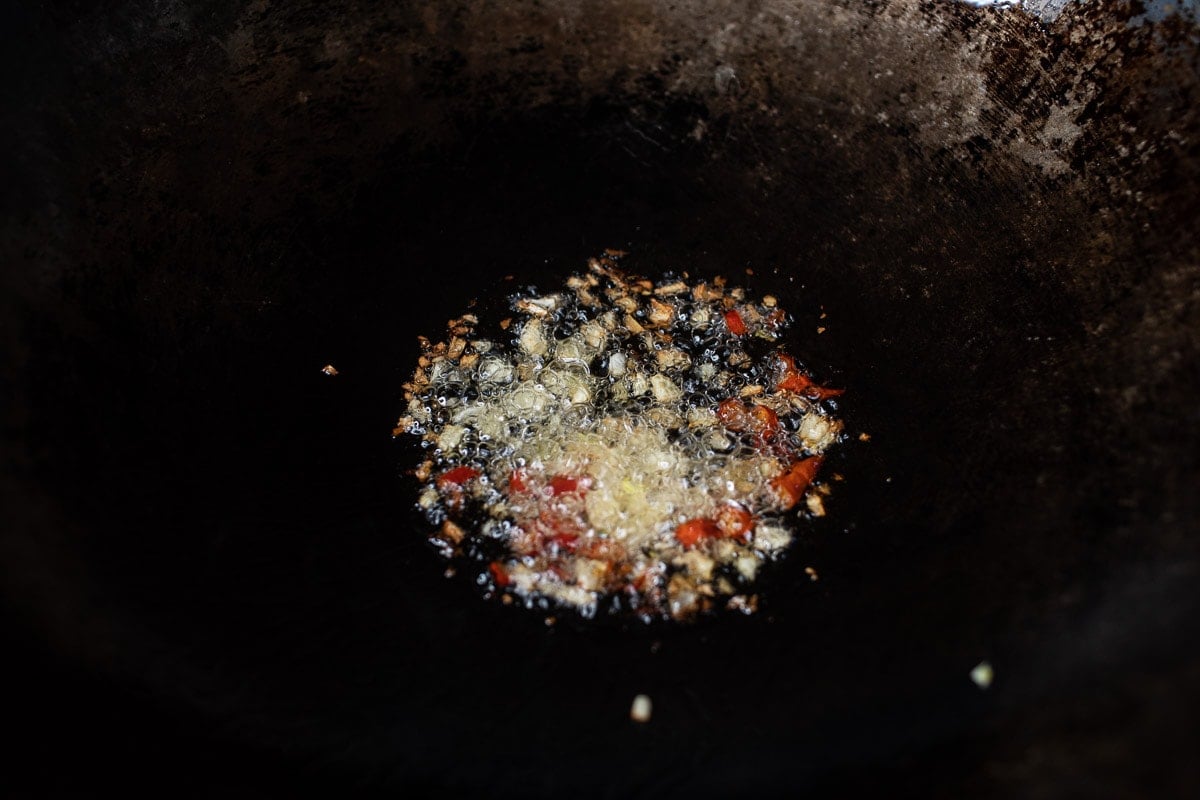 fried garlic and chilis in a wok