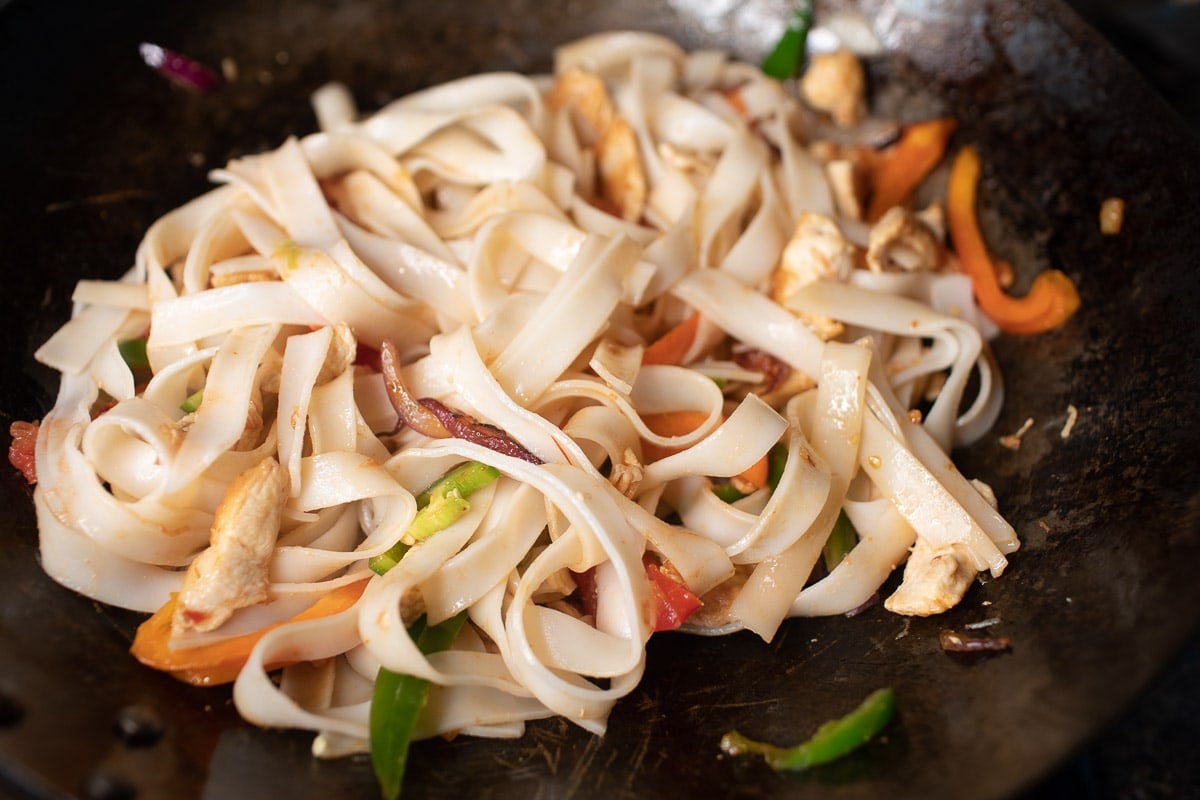 stir fried rice noodles in a wok