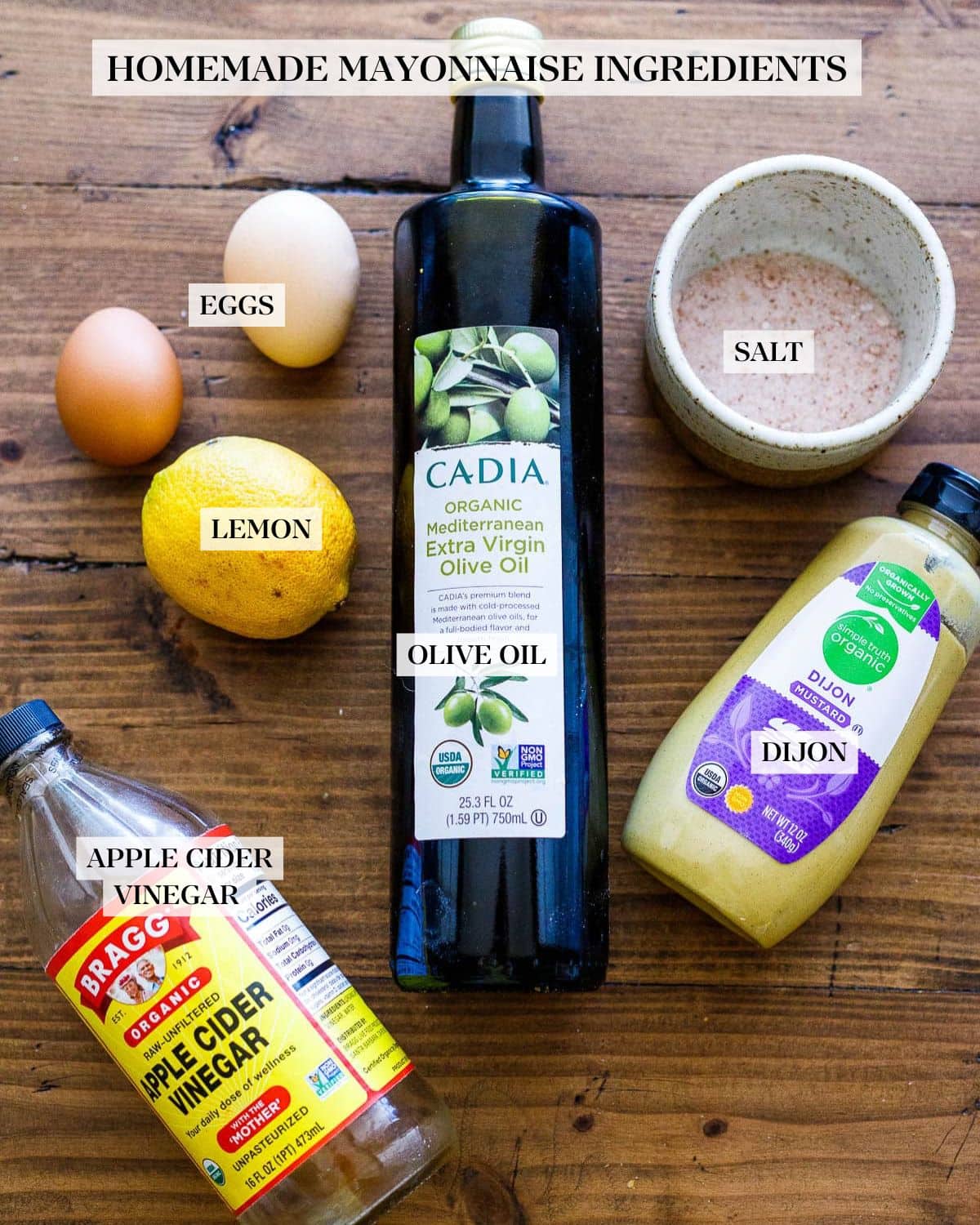 Ingredients in Olive Oil Mayonnaise Recipe - eggs, lemon, olive oil, salt, dijon mustard, and apple cider vinegar.