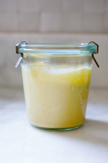 This easy mayonnaise recipe is made with olive oil, using an immersion blender right in the jar you'll store it in. Zero clean-up! It's creamy and light, great for burgers, sandwiches, dressings, and sauces.