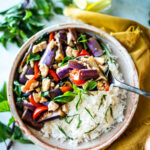 This Thai Eggplant Stir Fry is a delicious healthy meal featuring succulent eggplant, your choice of protein, fresh veggies in a flavorful Thai stir-fry sauce,  finished with aromatic Thai basil.