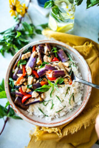 This Thai Eggplant Stir Fry is a delicious healthy meal featuring succulent eggplant, your choice of protein, fresh veggies in a flavorful Thai stir-fry sauce,  finished with aromatic Thai basil.