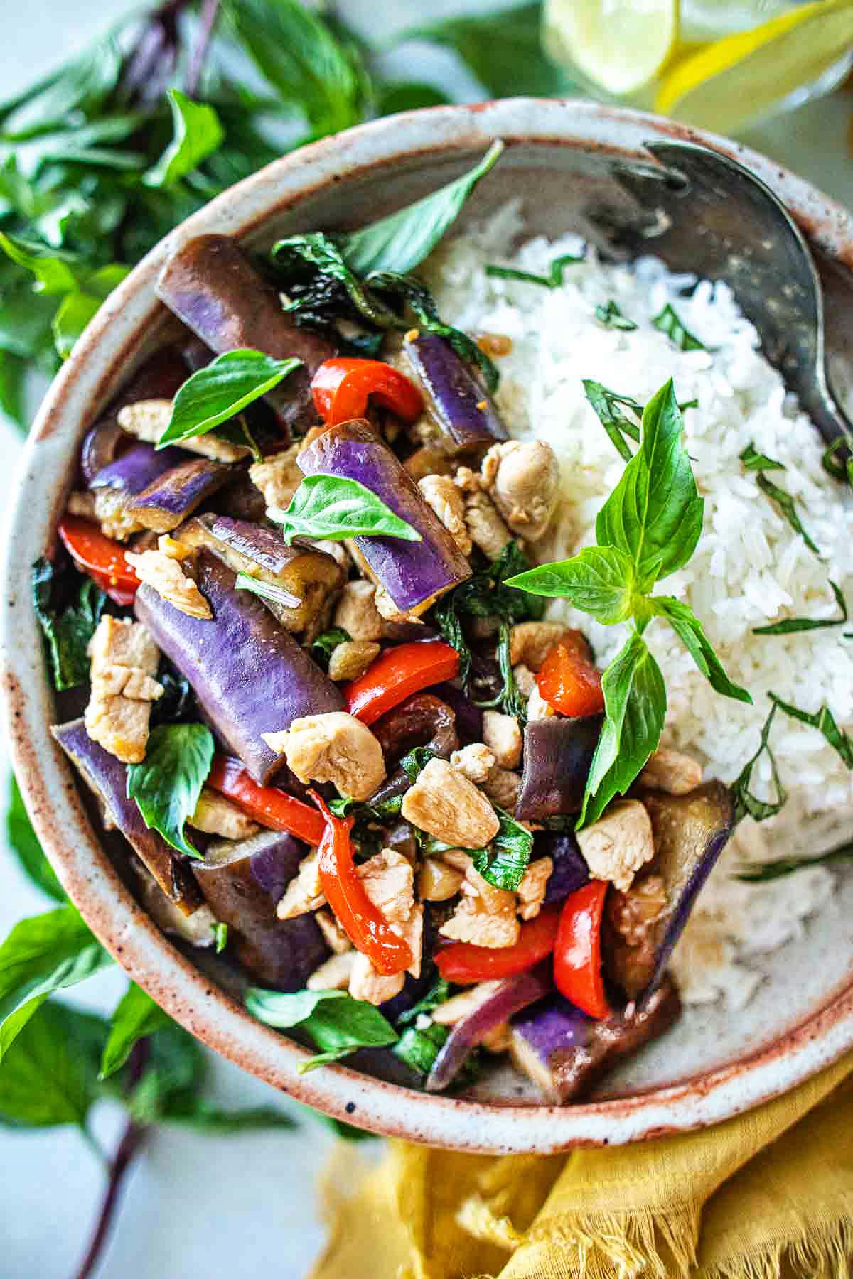 Thai Eggplant Stir Fry w/ your choice of protein, fresh veggies in a flavorful Thai stir-fry sauce with fragrant Thai basil. Vegan Adaptable.