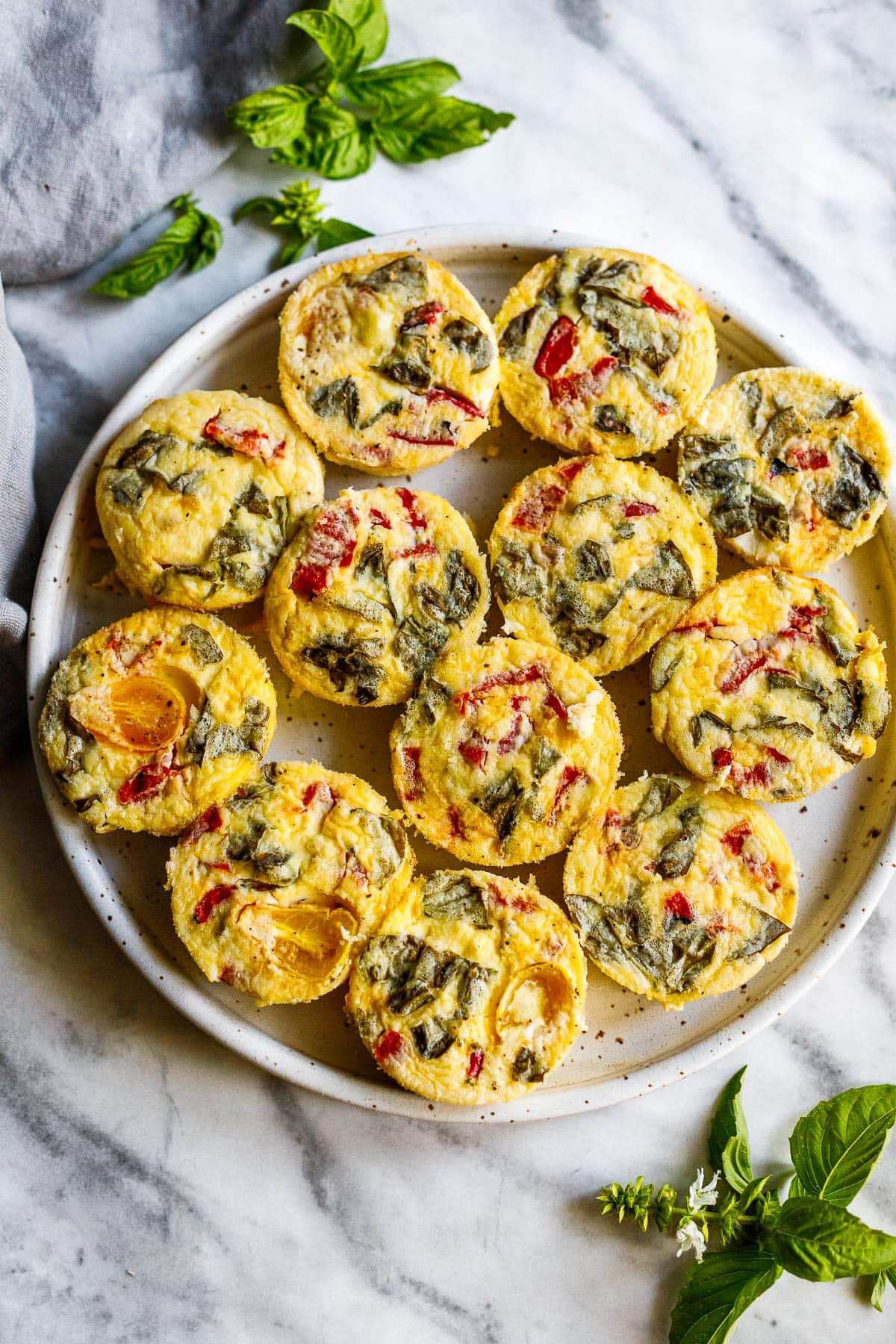 These quick and easy egg bites are the perfect make-ahead breakfast. Make them in 35 minutes, and store them in the fridge for the busy work week, or freeze and reheat. Keto and Vegetarian.