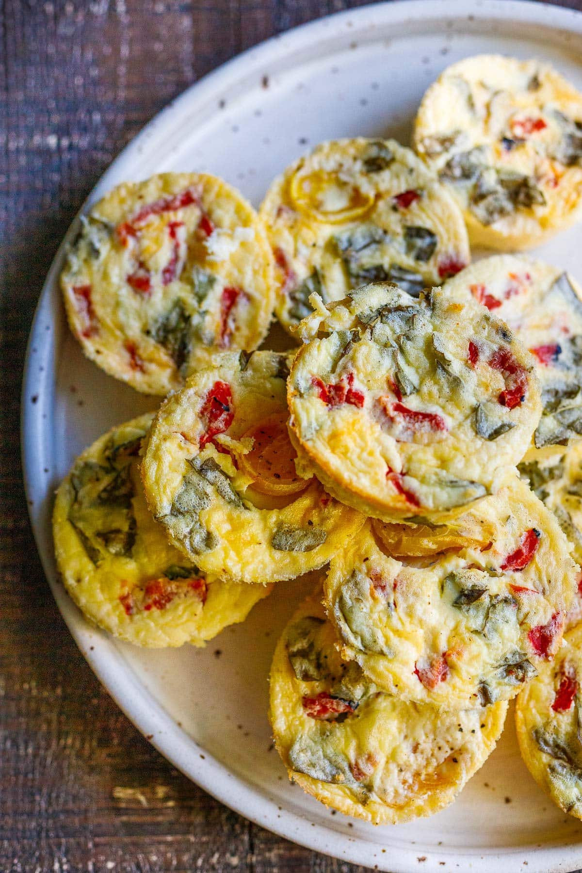 These quick and easy egg bites are the perfect make-ahead breakfast. Make them in 35 minutes, and store them in the fridge for the busy work week, or freeze and reheat. Keto and Vegetarian.