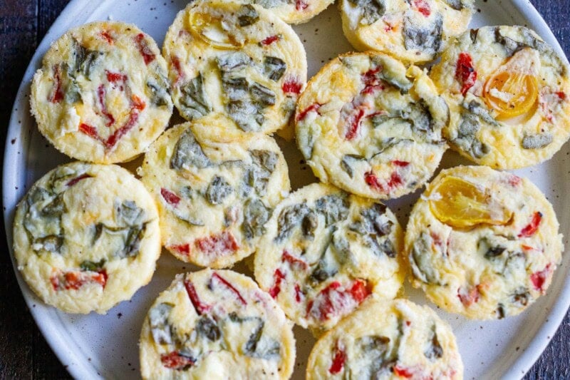 These quick and easy egg bites are the perfect make-ahead breakfast. Make them in 35 minutes, and store them in the fridge for the busy work week, or freeze and reheat. Keto and Vegetarian.