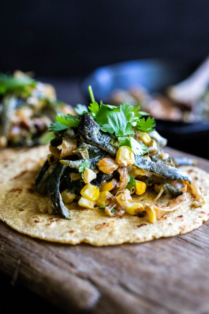 These Vegetarian Rajas Tacos are made with strips of poblano peppers, onions and corn in teh the most delicious sauce! Fast and easy.