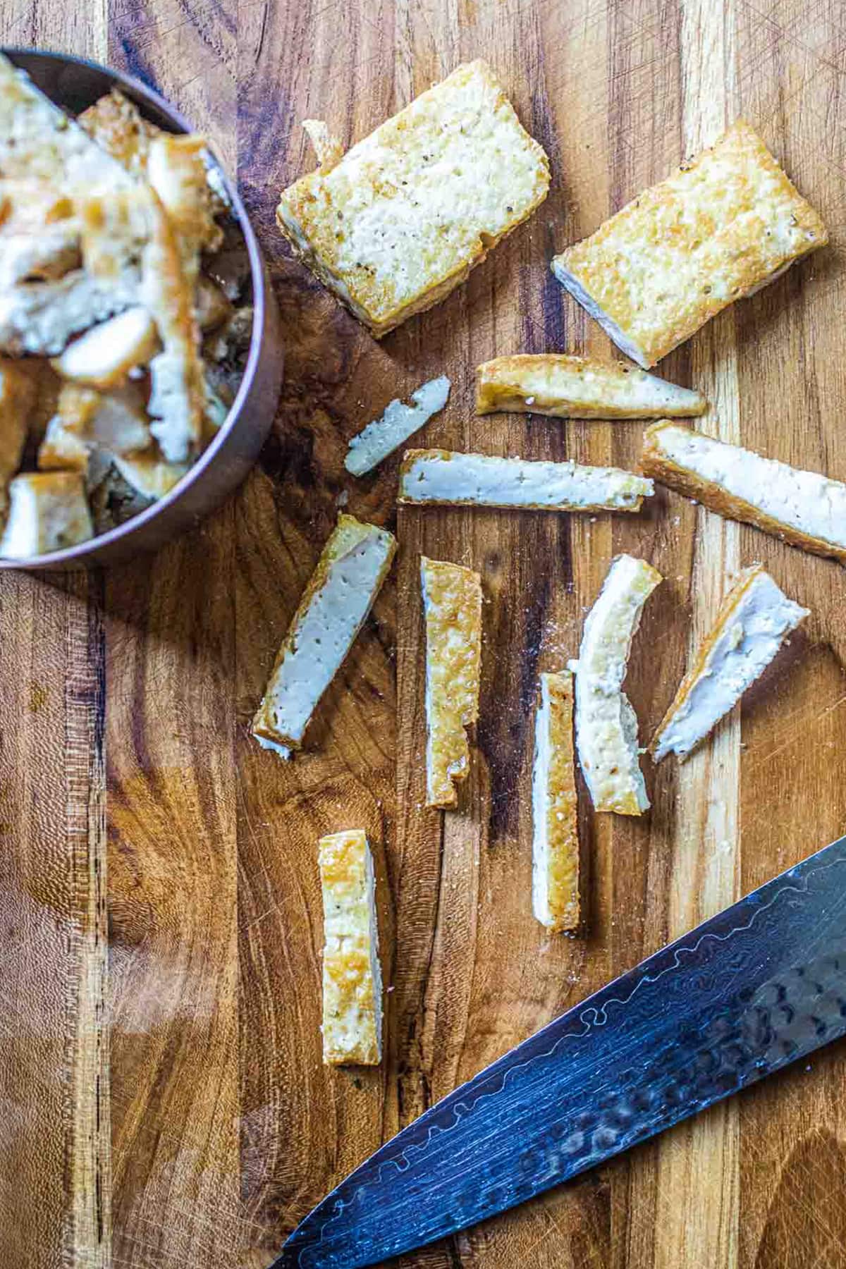 sliced crispy mushroom on a cutting board