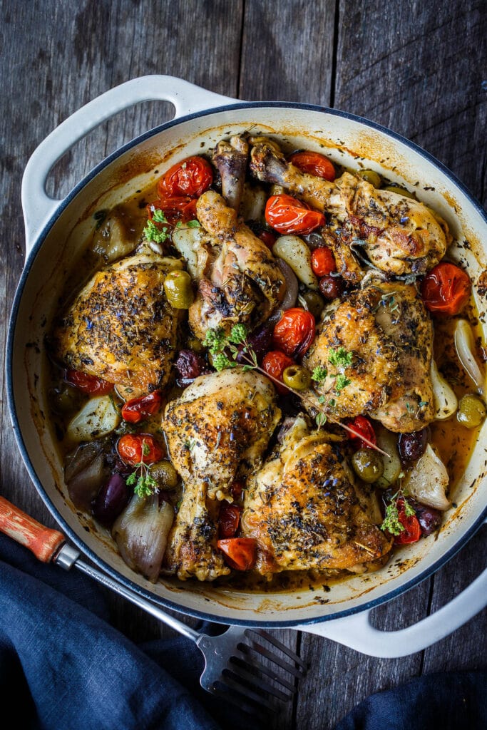 Our favoriteBraised Chicken Thigh Recipes: Chicken Provençal is all about ease and elegance!  Melty tender chicken seasoned with aromatic Herbs de Provence braised in white wine with olives, garlic and shallots.  So simple and so delicious.  Easy enough for a weeknight and elegant enough for company.