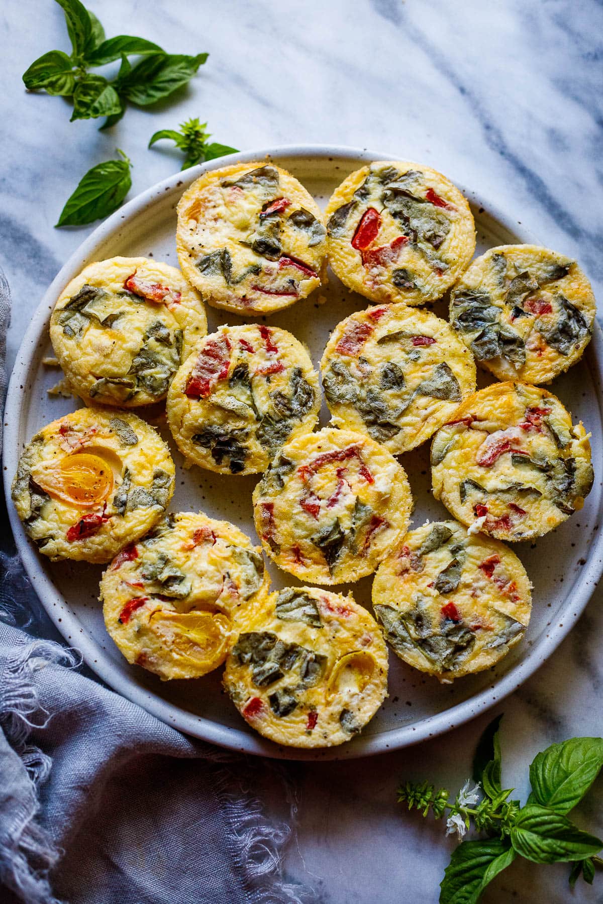 These quick and easy egg bites are the perfect make-ahead breakfast. Make them in 35 minutes, and store them in the fridge for the busy work week, or freeze and reheat. Keto and Vegetarian.