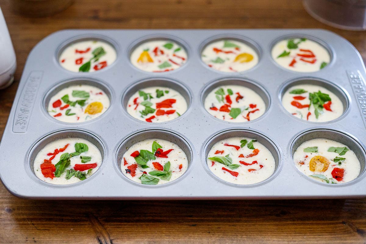 pour egg bite batter into a greased muffin tin