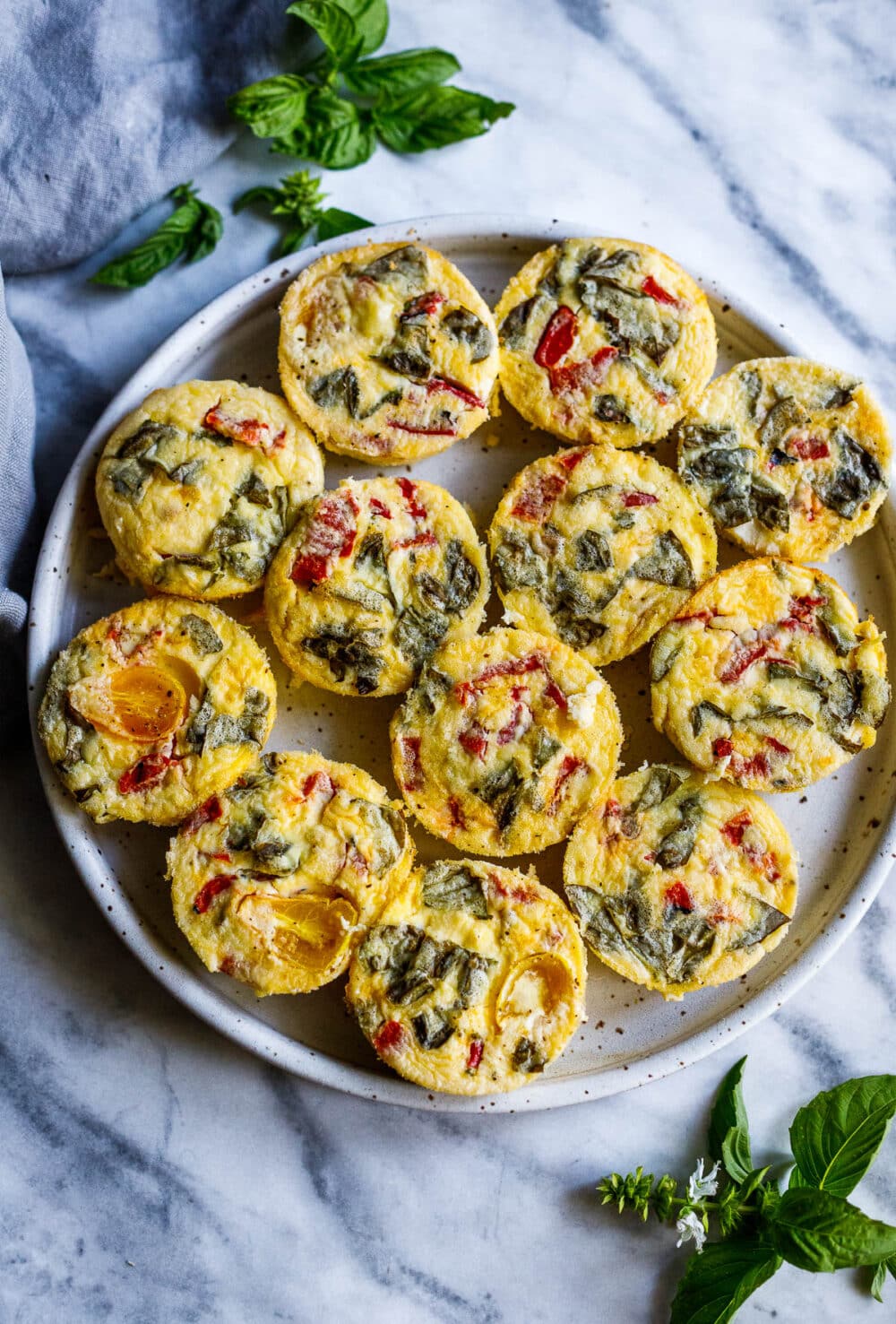 Quick and easy Egg Bites with roasted peppers and basil are the perfect make-ahead breakfast, ready in 35 minutes. Keto, Vegetarian.