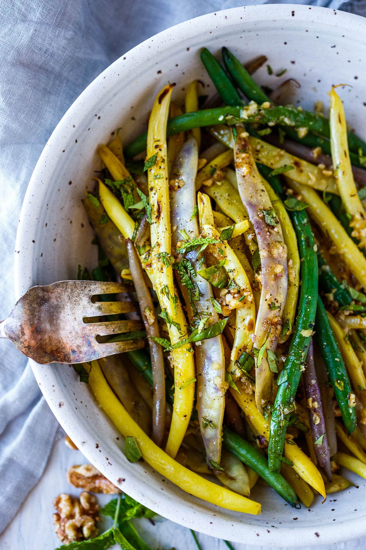 Green beans with Toasted Walnut Vinaigrette, a simple, delicious side dish that will enhance almost any meal.  Vegan and Gluten-free. 