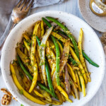 Green beans with Toasted Walnut Vinaigrette, a simple, delicious side dish that will enhance almost any meal. Vegan and Gluten-free.