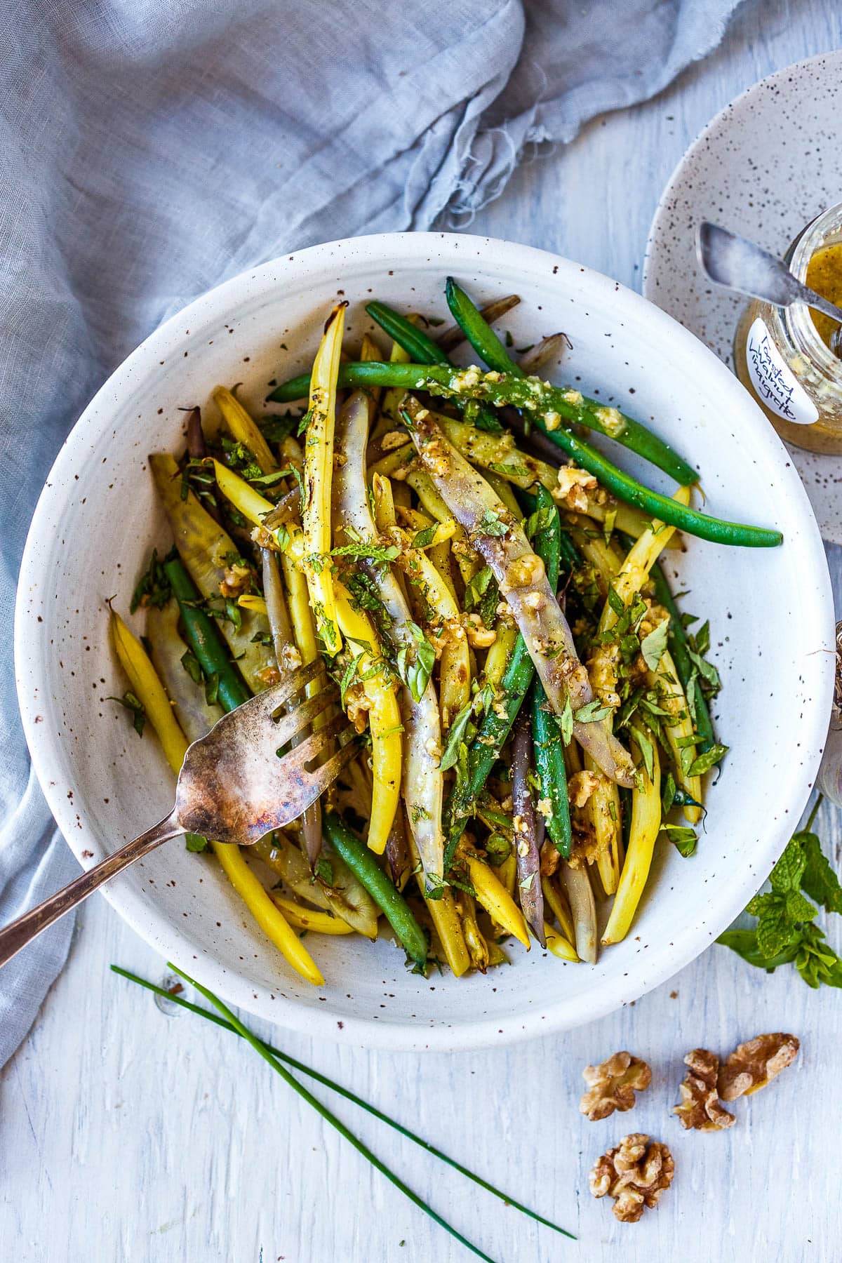 Green beans with Toasted Walnut Vinaigrette, a simple, delicious side dish that will enhance almost any meal.  Vegan and Gluten-free. 