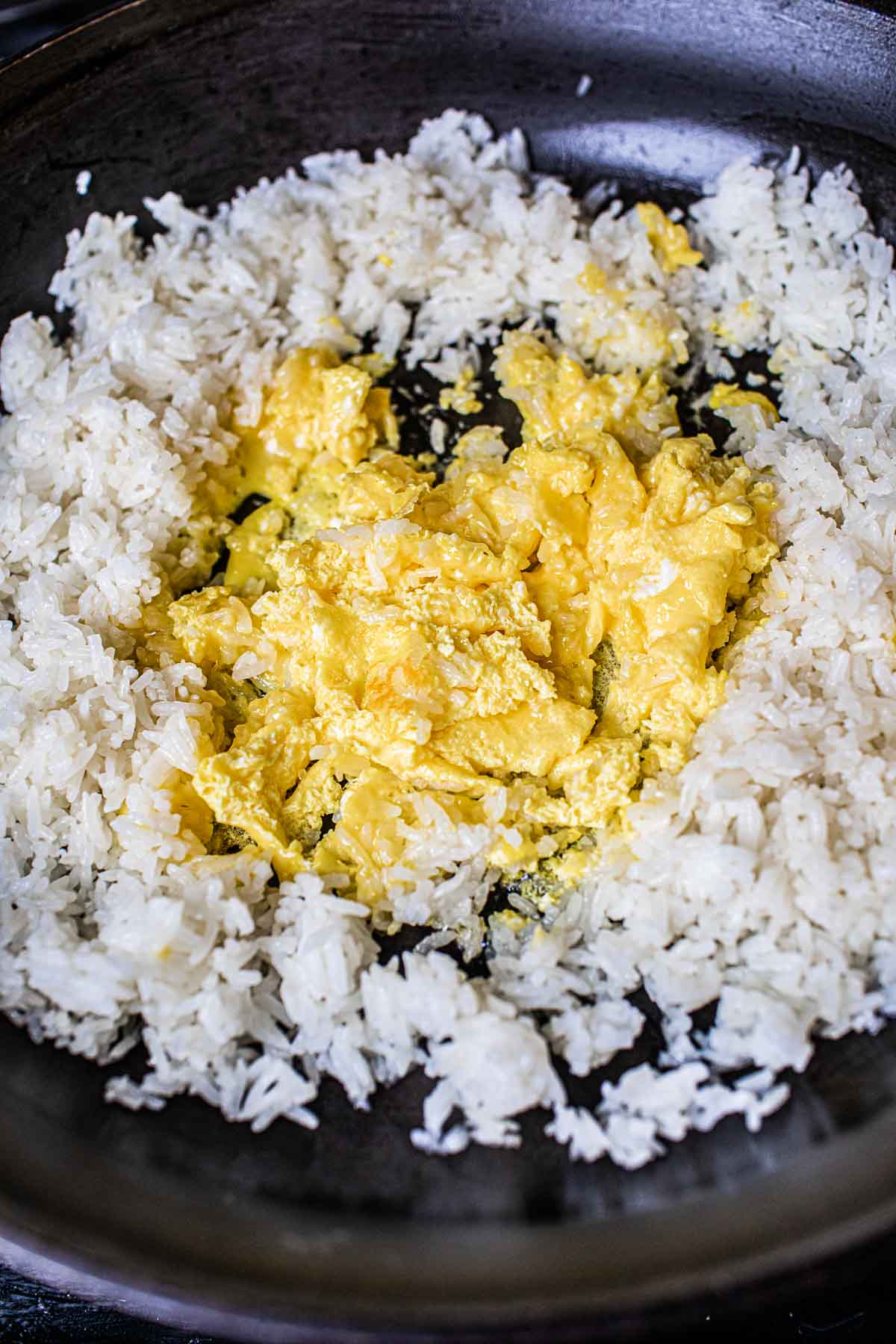 scrambled eggs in crater of jasmine rice