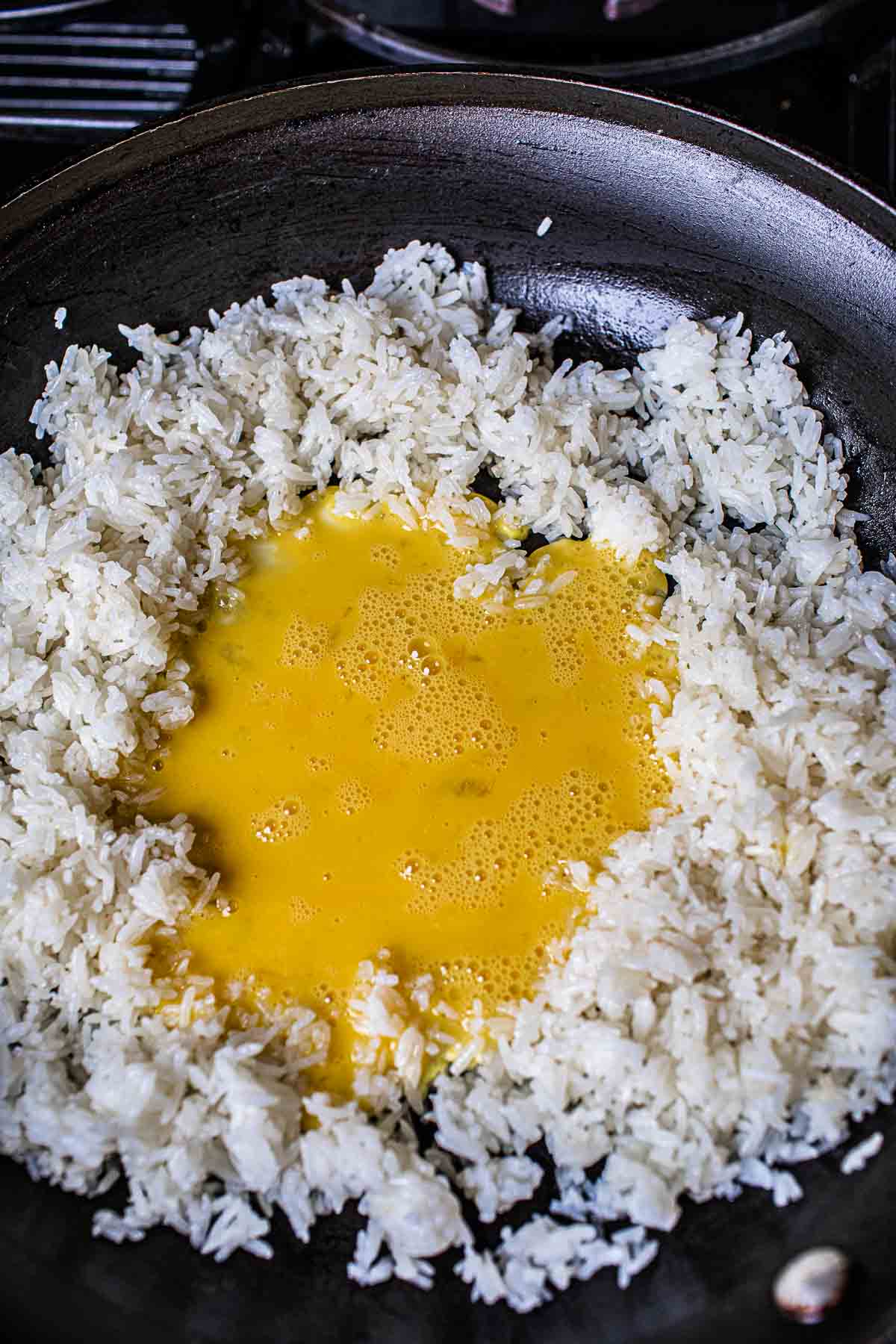 whisked eggs in crater of jasmine rice
