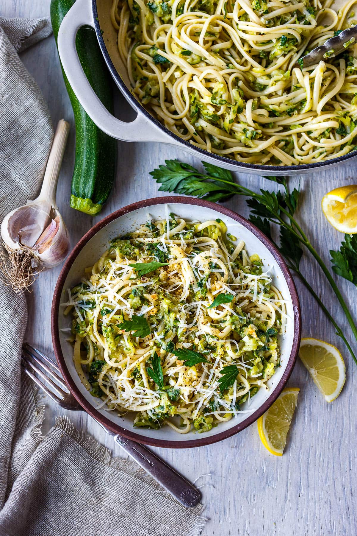 Here's a quick and simple recipe for creamy Zucchini Pasta. Grated zucchini melts into a flavorful succulent sauce, perfect for cradling linguini or your favorite pasta! Enhanced with lemon, black pepper and garlic you'll have this on the table in 30 minutes!  Vegan and gluten-free adaptable.