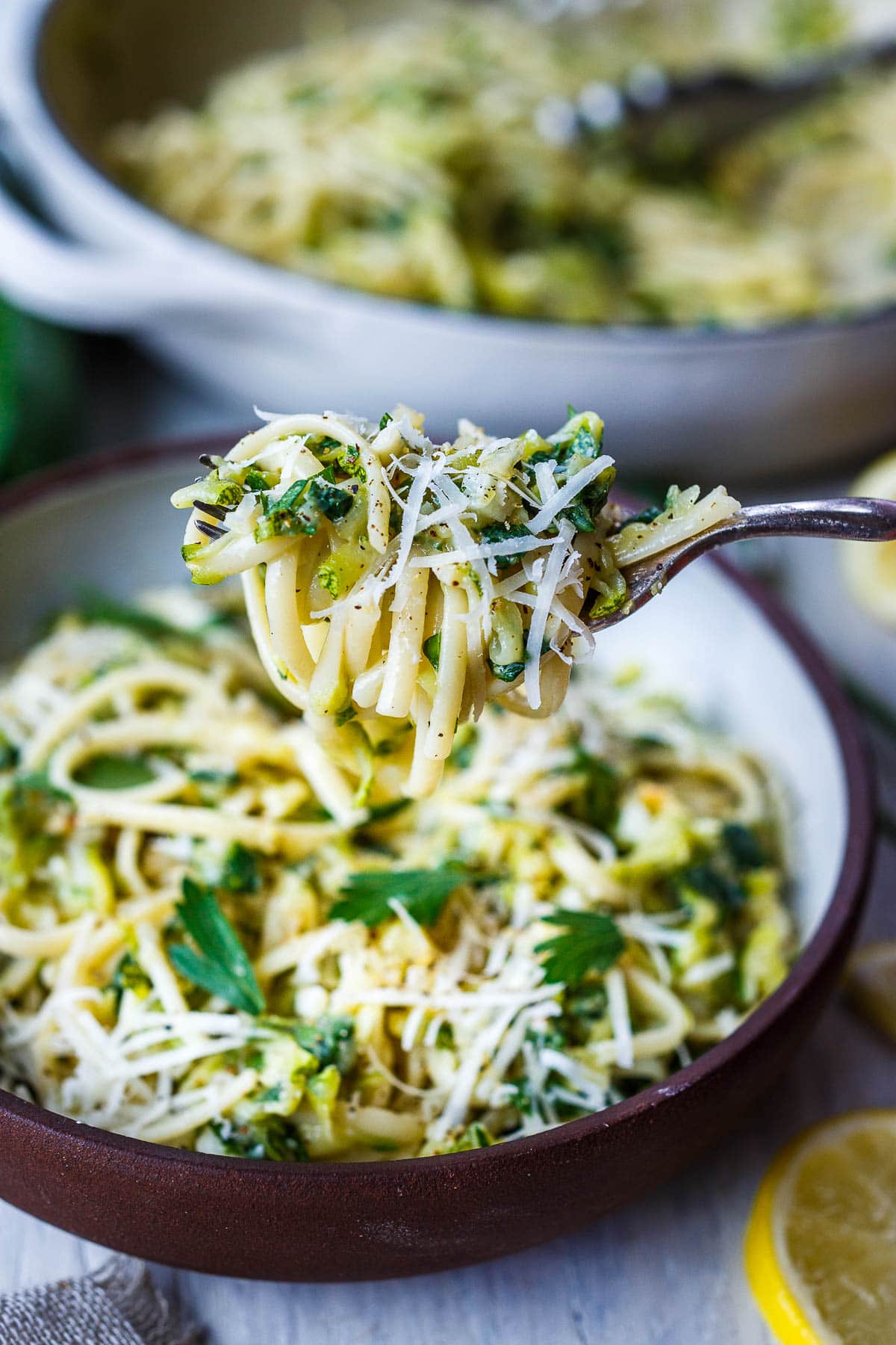 Here's a quick and simple recipe for creamy Zucchini Pasta. Grated zucchini melts into a flavorful succulent sauce, perfect for cradling linguini or your favorite pasta! Enhanced with lemon, black pepper and garlic you'll have this on the table in 30 minutes!  Vegan and gluten-free adaptable.