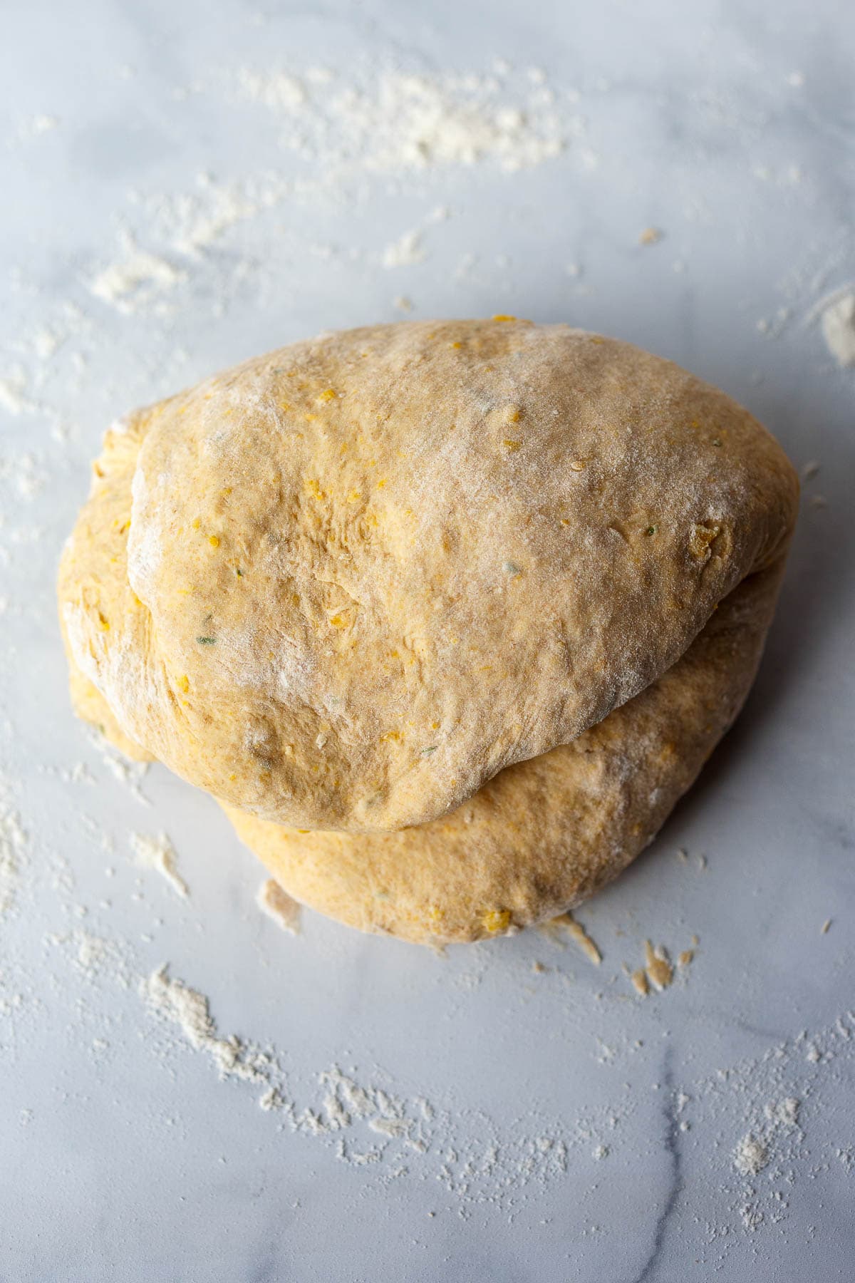 Kneading by hand to make sure all dough is smooth and incorporated.