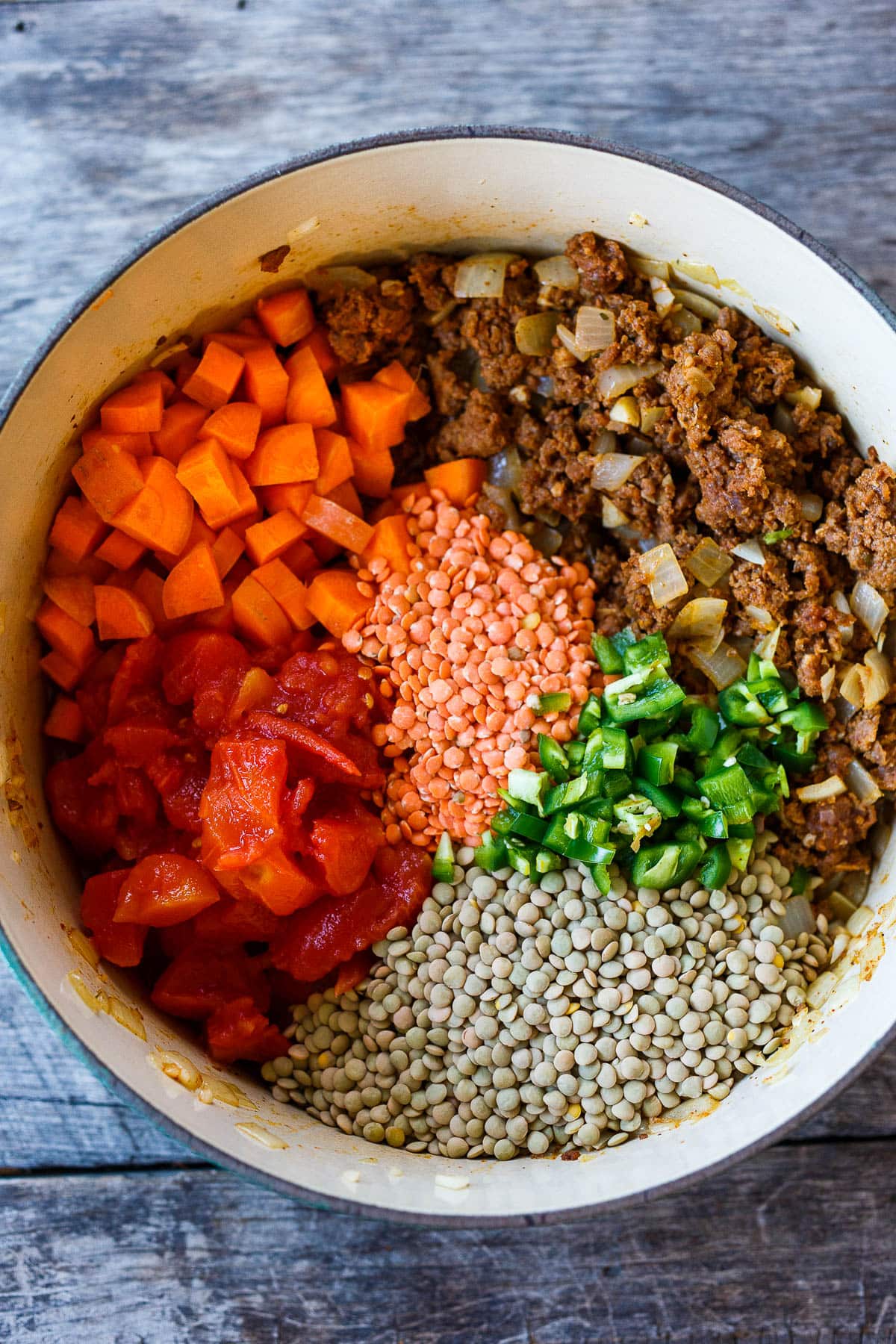 All ingredients in Lentil Chili in the ceramic pot.