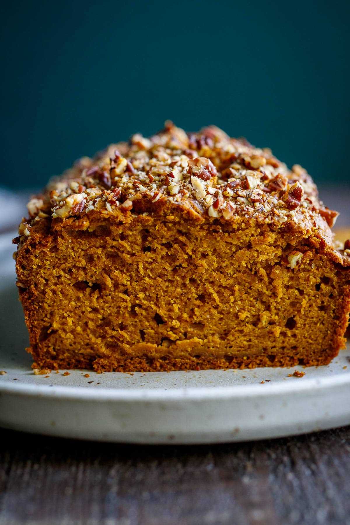 A delicious recipe for Pumpkin Bread with double the spices. This version is maple sweetened, with a crunchy nut topping, optional chocolate chips, and a moist tender crumb. Vegan-adapatable. 