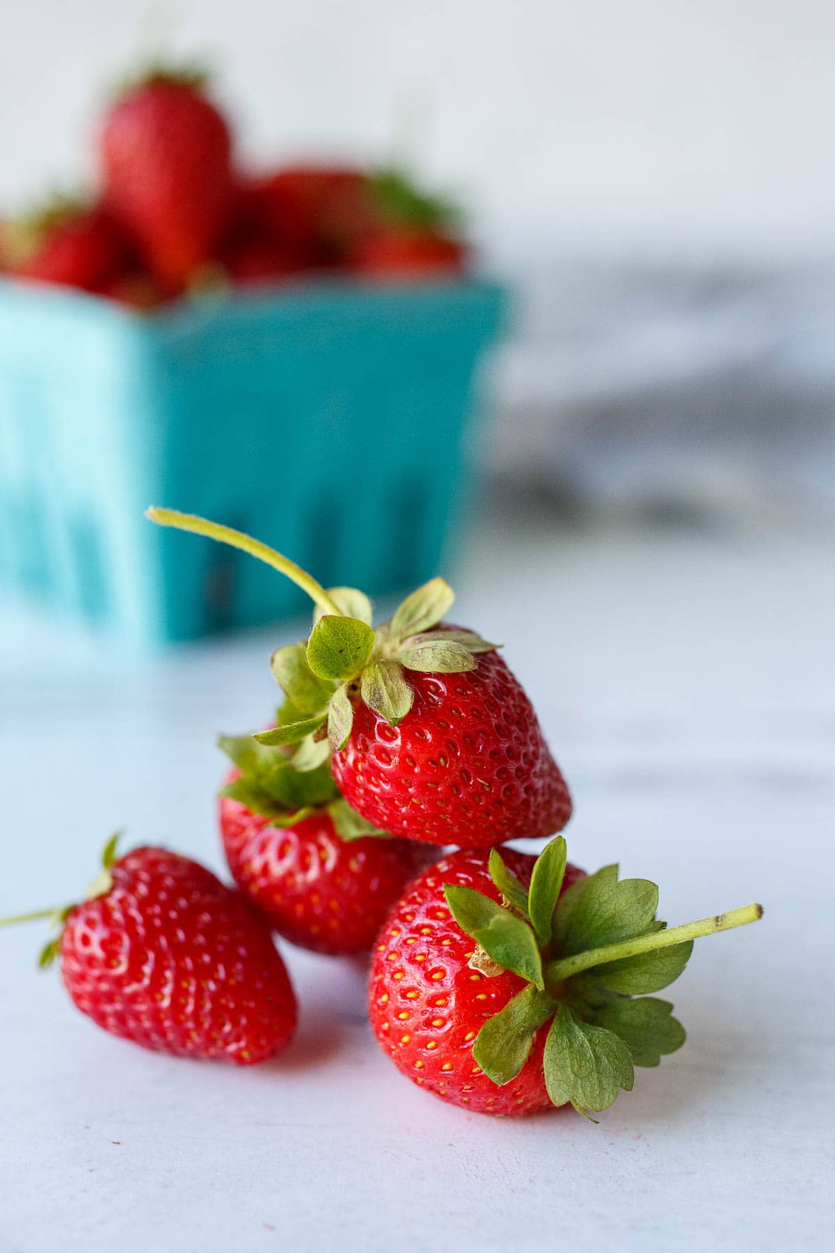 Fresh strawberries with stems.