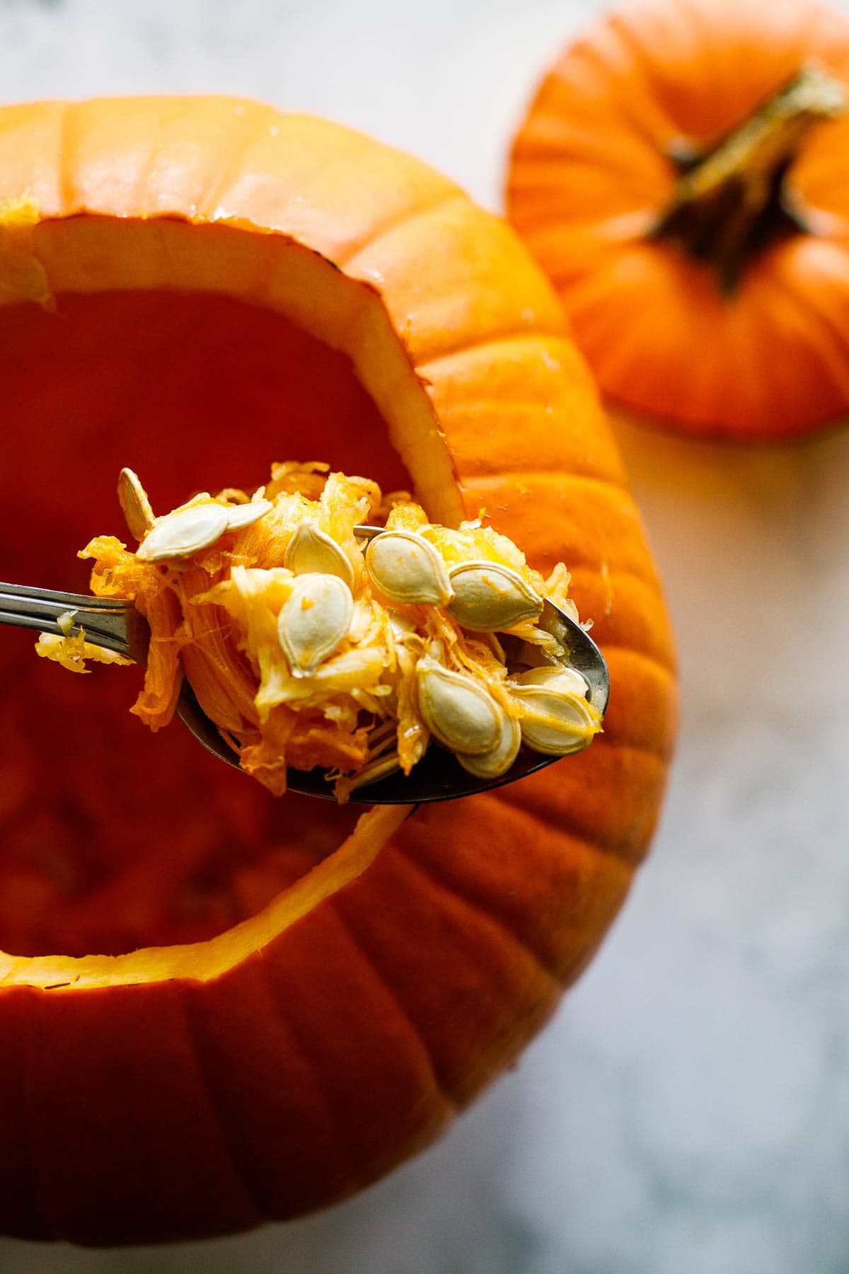 scooping out the pumpkin seeds