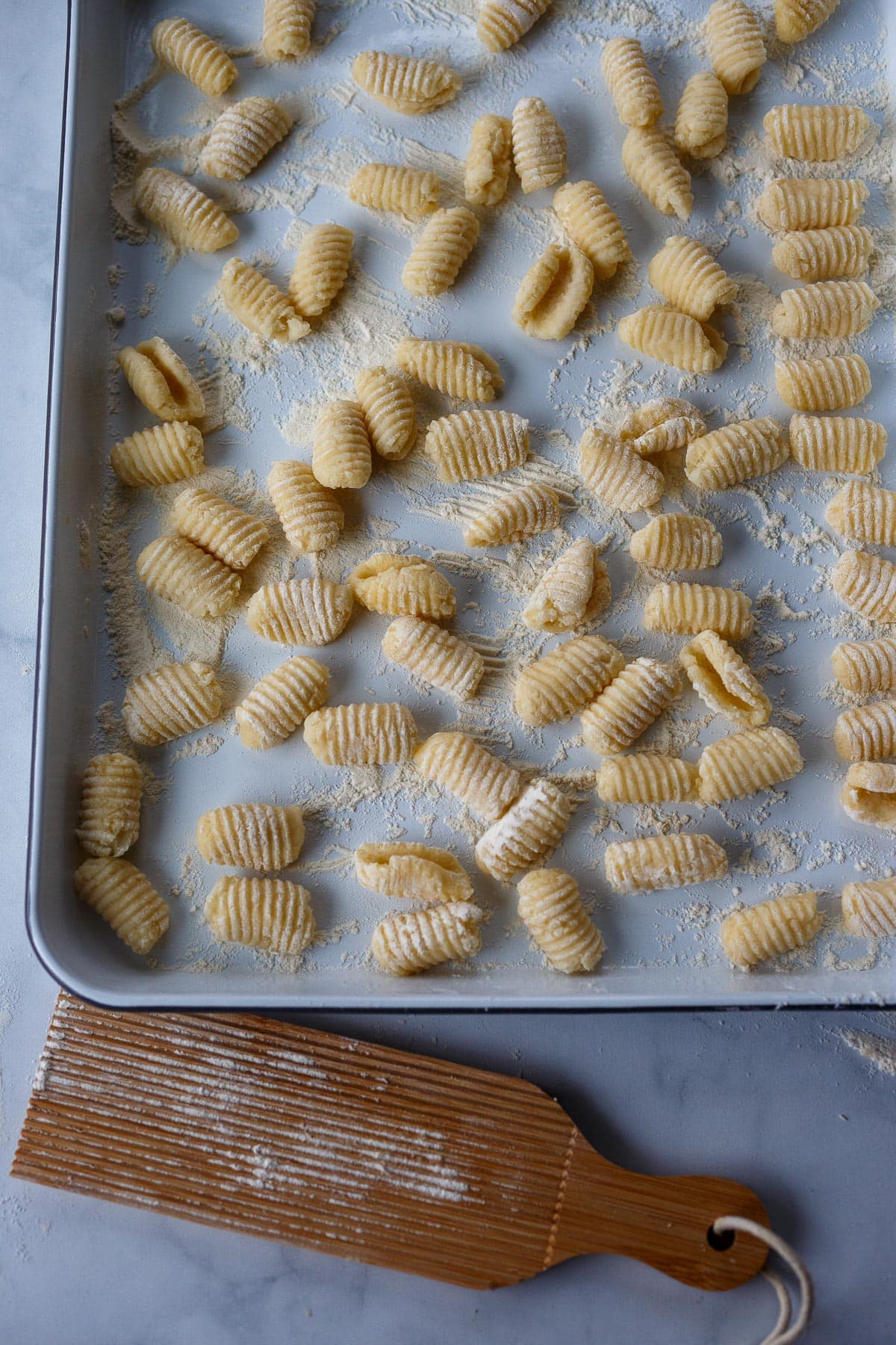 Fresh gnocchi on a pan.