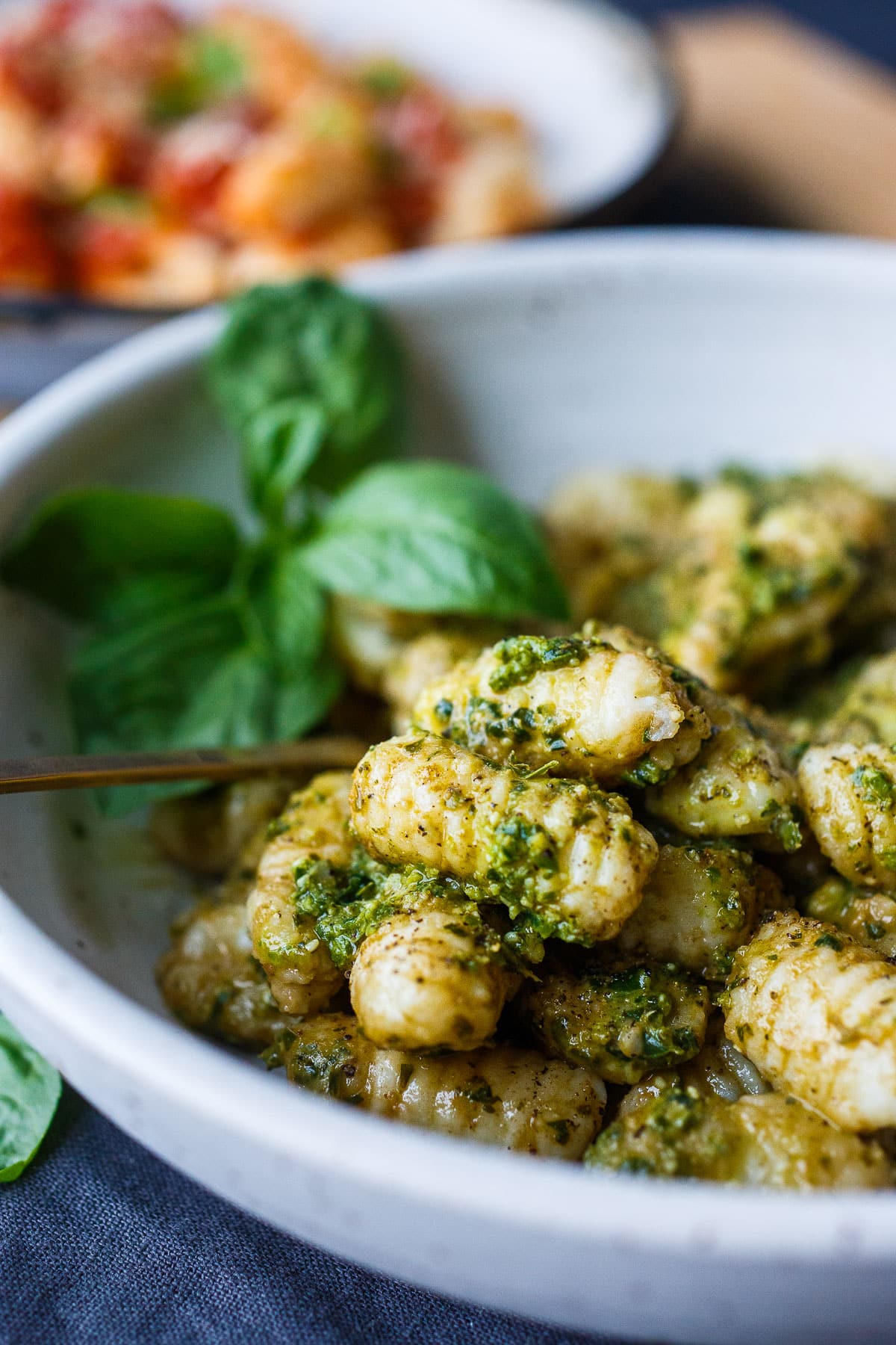 Homemade potato gnocchi! Just four simple ingredients result in the dreamiest little dumplings.  These little pillows of joy are easy to make and much more delicious than store-bought. From baked and sautéed to boiled you'll find so many ways to use them! 
