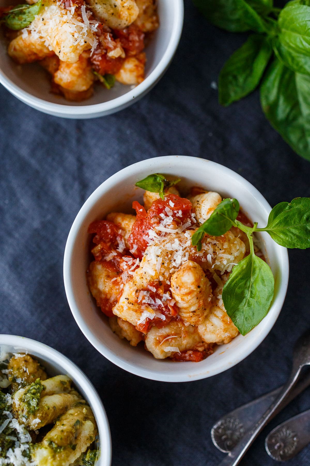 Homemade potato gnocchi! Just four simple ingredients result in the dreamiest little dumplings.  They are actually easier to make then you may think and so much more delicious than store-bought. From baked and sautéed to boiled you'll find so many ways to use them! 