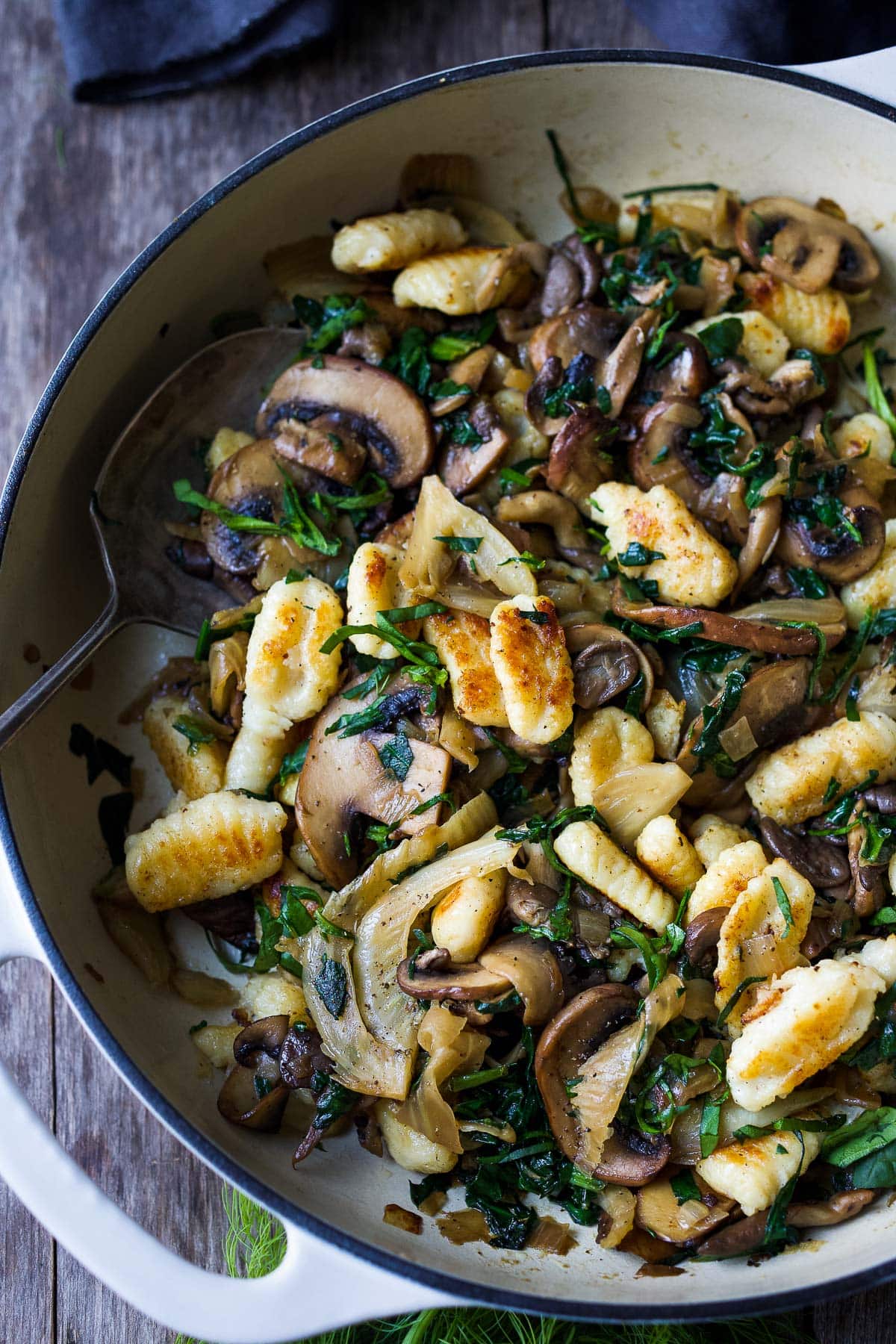 Caramelized fennel, sautéed mushrooms and wilted spinach combine perfectly with pan-seared potato gnocchi, a quick vegetarian dinner!