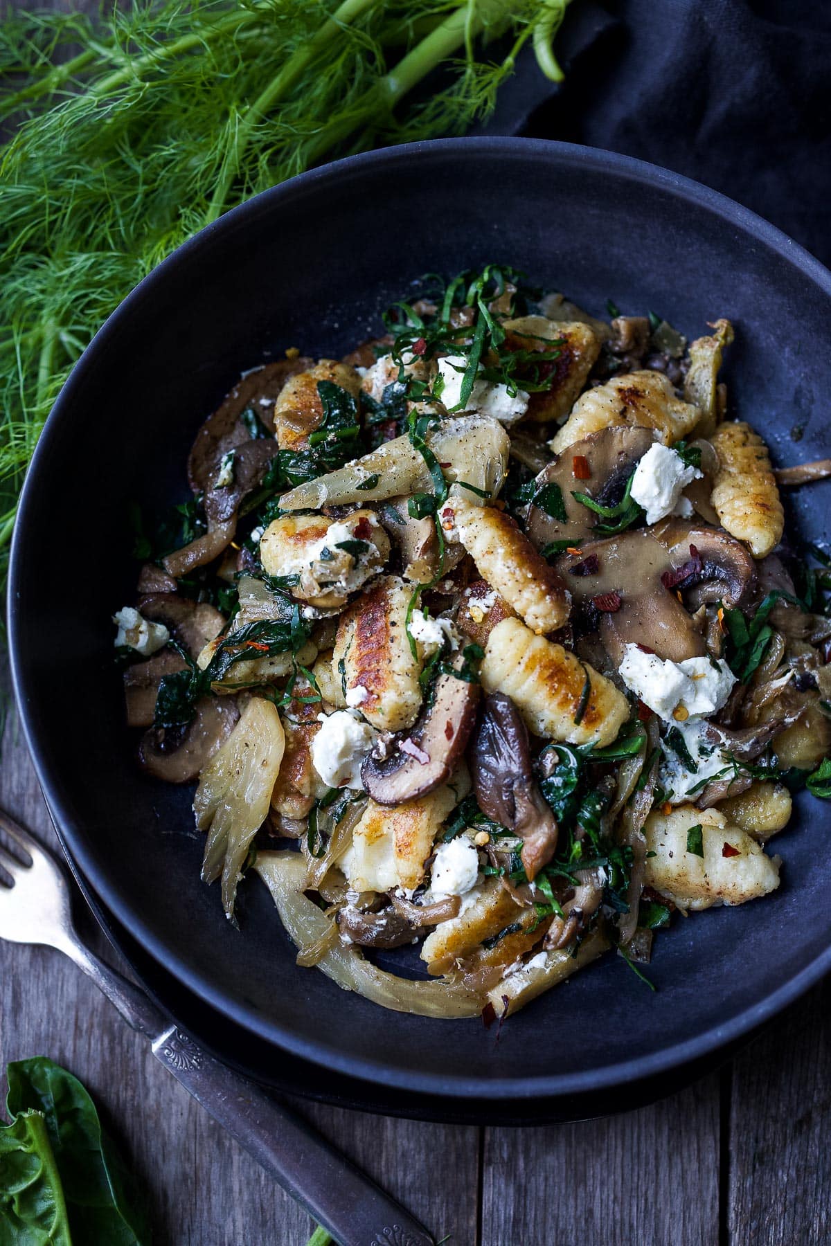 Caramelized fennel, sautéed mushrooms and wilted spinach combine perfectly with pan-seared potato gnocchi, a quick vegetarian dinner!