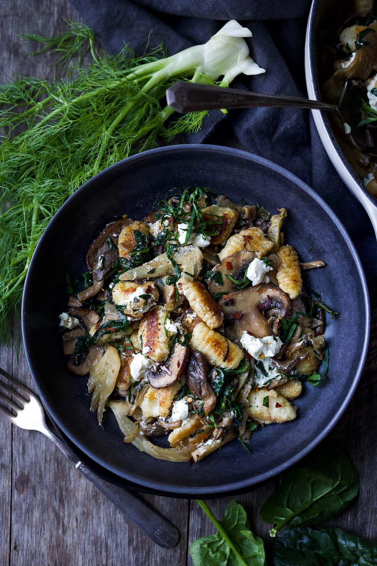 Caramelized fennel, sautéed mushrooms and wilted spinach combine perfectly with pan-seared potato gnocchi, a quick vegetarian dinner!