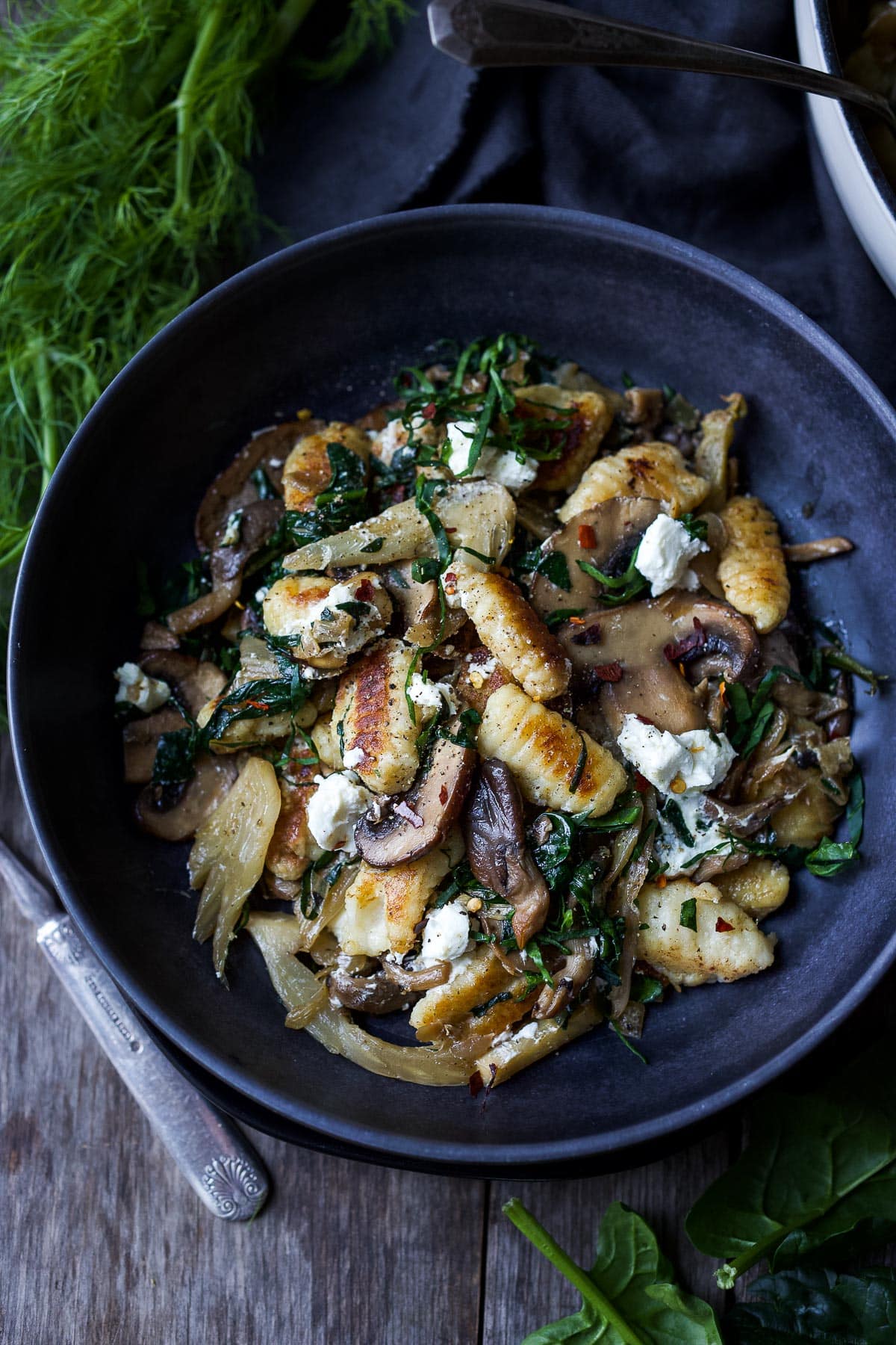 Caramelized fennel, sautéed mushrooms and wilted spinach combine perfectly with pan-seared potato gnocchi and topped with creamy goat cheese. Savory rich flavors, yet simple to put together!
