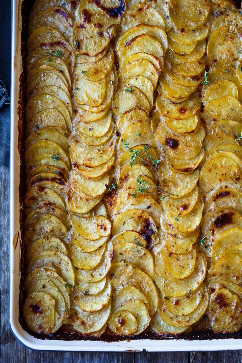These easy Scalloped Potatoes are made with simple ingredients and just 25 minutes of hands-on time, before baking in the oven. Tender and creamy with a golden crispy top, they are perfect for weeknights or the holiday table.