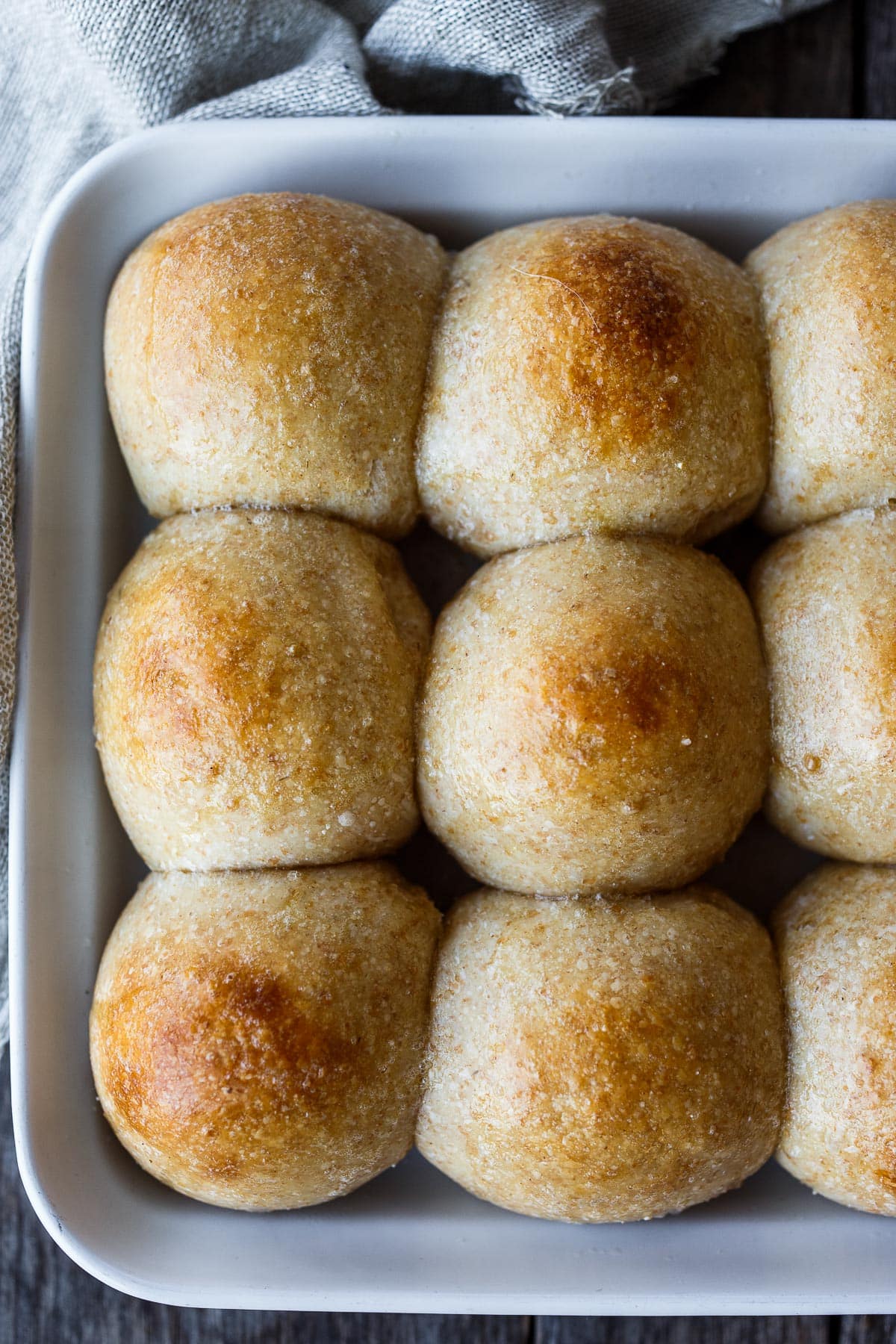 Perfectly tender and ultra flavorful sourdough dinner rolls are made completely with active starter, no yeast. Make in one day or refrigerate overnight.  They freeze well and are vegan adaptable! 